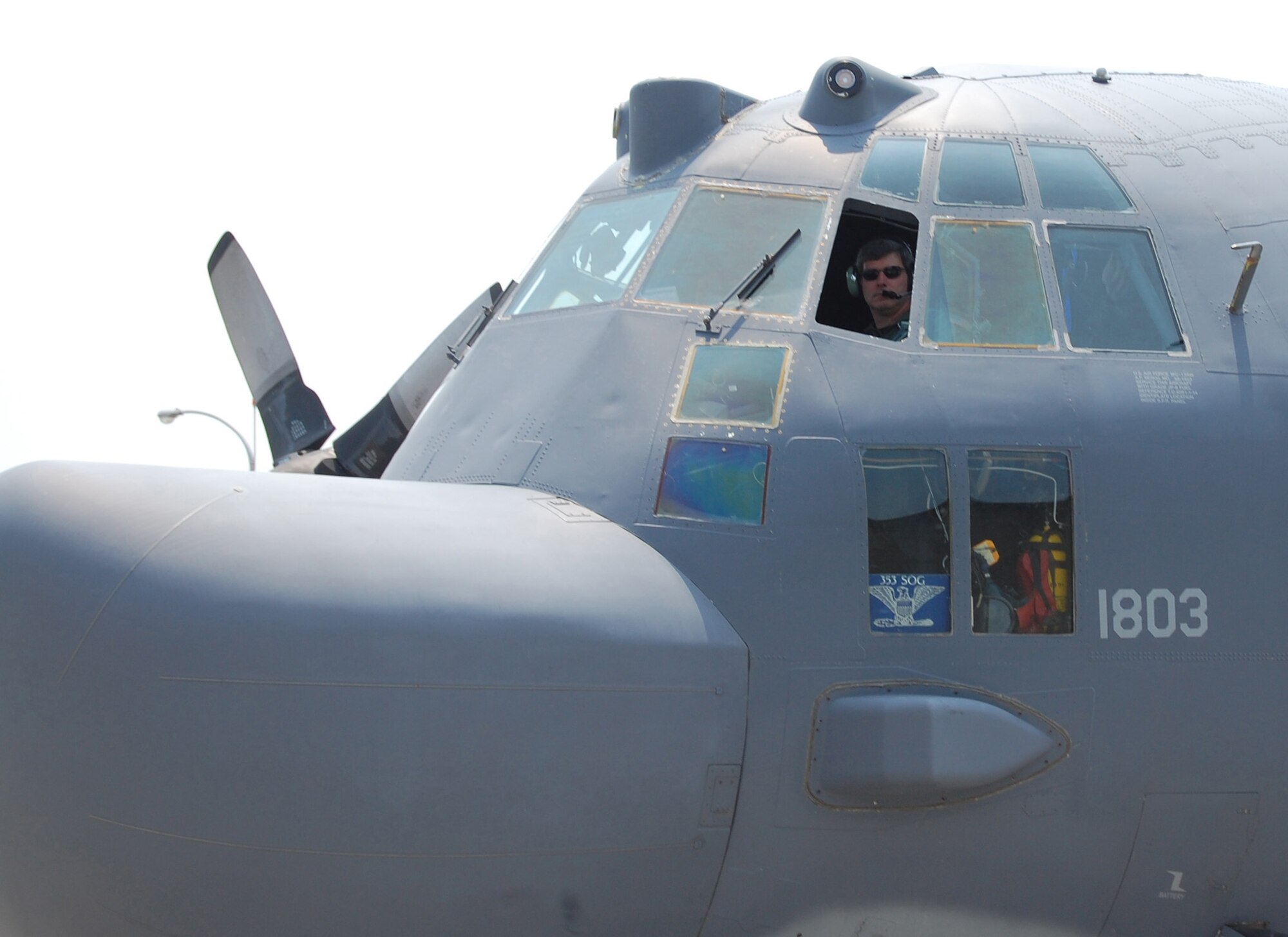 KADENA AIR BASE, Japan -- Col. David Mullins, the 353rd Special Operations Group commander, looks out the cockpit of a MC-130H Combat Talon II here June 1 before his final flight before moving on to his next assignment. The colonel flew in both a MC-130H and MC-130P Combat Shadow for his final flight. (U.S. Air Force photo by James D'Angina) 