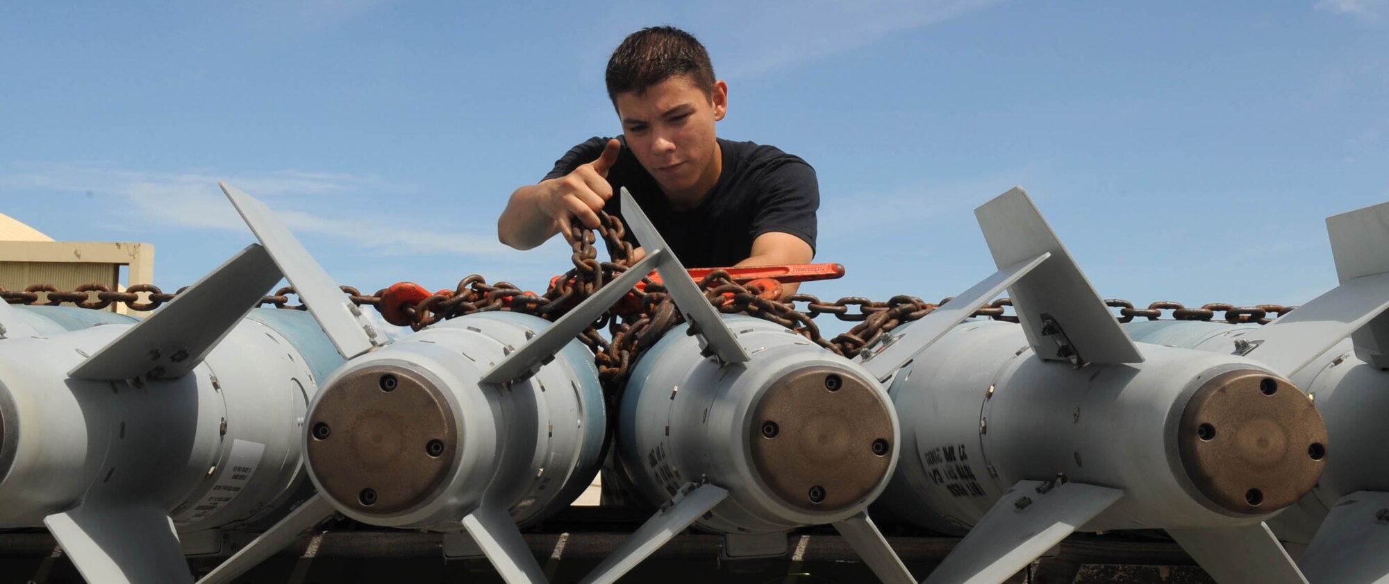 ANDERSEN AIR FORCE BASE, Guam - Senior Airman Louie E. Gaitan, 36th Expeditionary Aircraft Maintenance Squadron B-2 weapons load team member, prepares munitions to be loaded on a B-2 Spirit.  The Highland Falls, N.Y., native is deployed here to Andersen Air Force Base, Guam, from Whiteman AFB, Mo.  The B-2 was flying as part of a training mission, Polar Lightning, from Andersen AFB to Elmendorf AFB, Alaska.