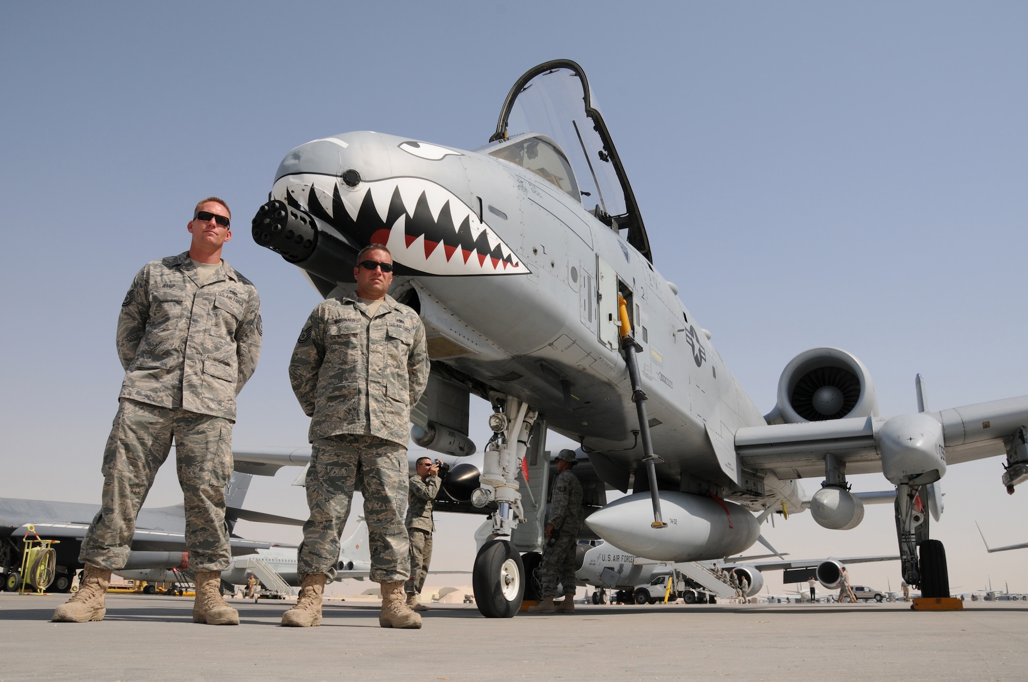 Tech. Sgt. James Jessup, a dedicated crew chief and Tech. Sgt. Colin McDonald, an engine specialist, both with the 455th Expeditionary Maintenance Squadron at Bagram Air Base, Afghanistan stand with an A-10C Thunderbolt II close air support aircraft at Flightline Fest, May 29, 2009, in an undisclosed location in Southwest Asia.  The 379th Air Expeditionary Wing hosted the half day event which gave base personnel the chance to look at static aircraft displays and other equipment up close, all without interrupting the mission of providing combat airpower throughout the U.S. Central Command's area of responsibility.  Tech. Sgt. Jessup is from Kiowa, Colo. and Tech. Sgt. McDonald is from Hampshire, Ill., both are deployed from Moody Air Force Base, Ga., in support of Operations Iraqi and Enduring Freedom and Combined Joint Task Force-Horn of Africa.  (U.S. Air Force photo by Senior Master Sgt. Brad Fallin/released)