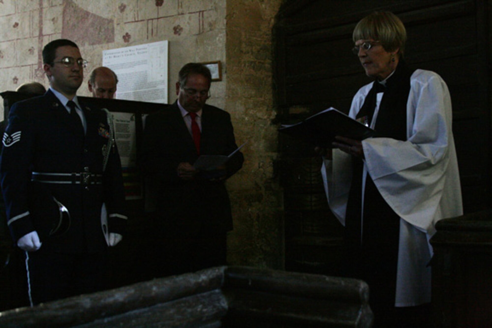 Reverend Jan Brookshaw says the benediction at a memorial dedication service at St. Mary's Church, Yelden, Bedfordshire. The service honored U.S. military personnel who died March 24, 1944 when a B-17 Flying Fortress crashed upon takeoff from RAF Cheveston. The crash killed 11 aircrew members, eight military personnel on the ground and two children from the village. 
