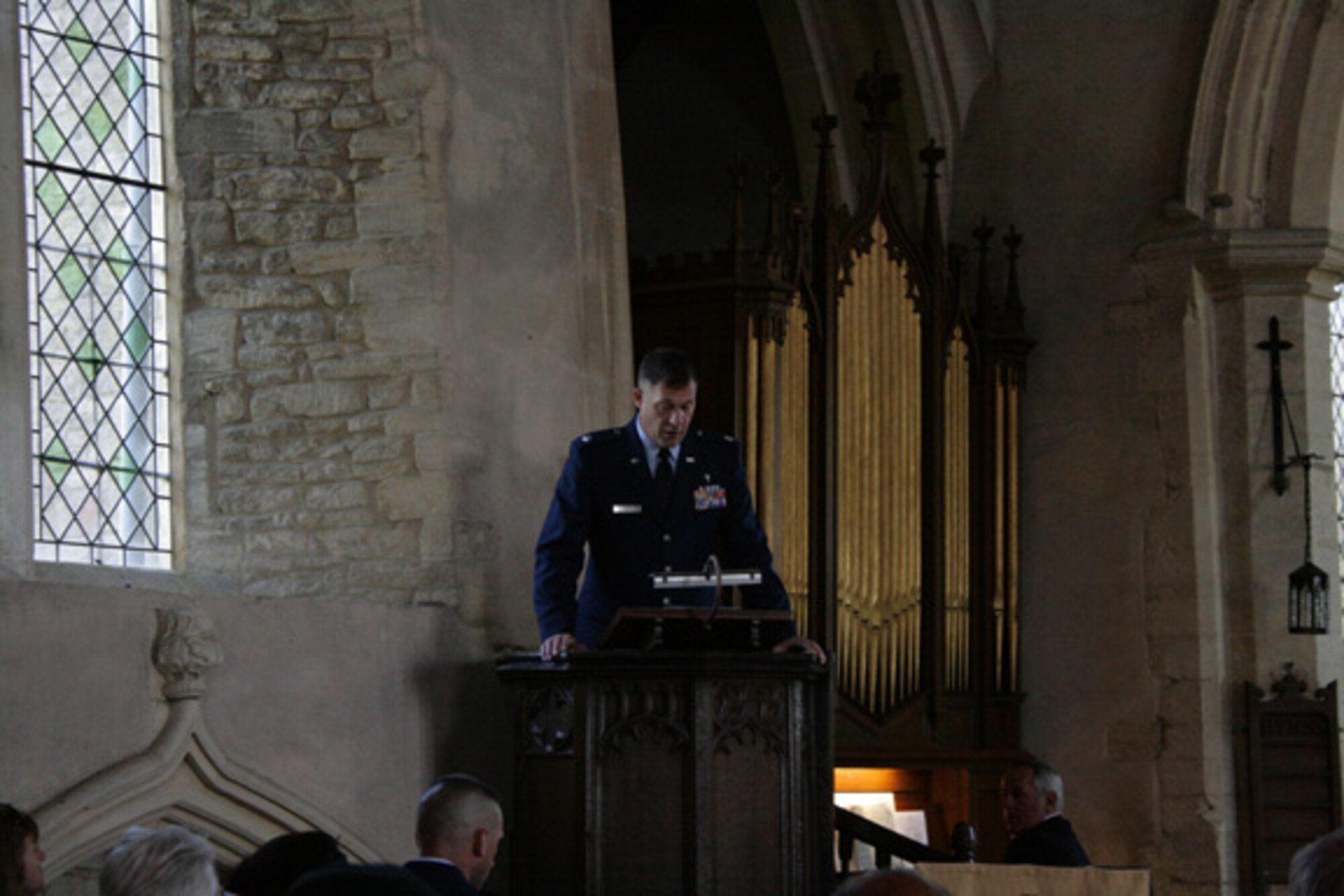 Chaplain (Lt. Col.) Walter Bean gives a sermon at a memorial dedication service at St. Mary's Church, Yelden, Bedfordshire. The service honored U.S. military personnel who died March 24, 1944 when a B-17 Flying Fortress crashed upon takeoff from RAF Cheveston. The crash killed 11 aircrew members, eight military personnel on the ground and two children from the village. 