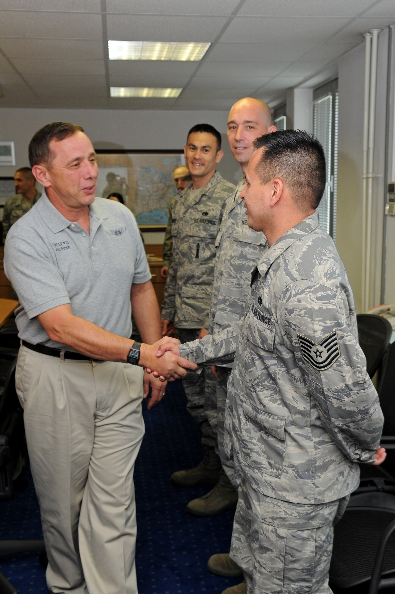 Frederick J. Finch, 13th Chief Master Sergeant of the Air Force, greets Tech. Sgt. Jose Gonzalez, Kisling Noncommissioned Officer Academy instructor, at the academy on Kapaun Air Station, Germany, May 22, 2009. (U.S. Air Force photo by Airman 1st Class Grovert Fuentes-Contreras) (Released)