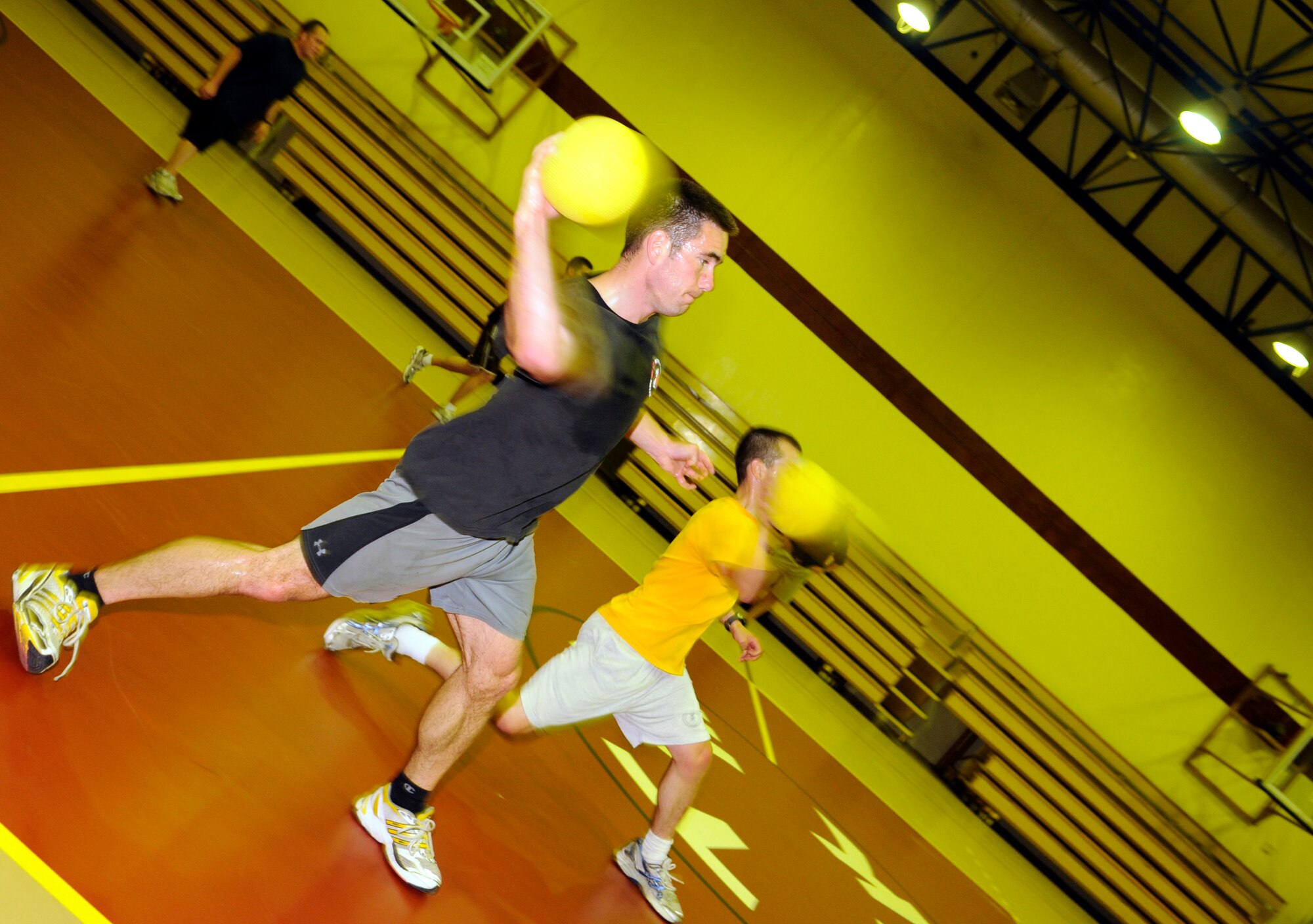 Jacob Yates, 90th Expeditionary Air Refueling Squadron, takes aim at members of the team representing the 39th Medical Operations Squadron during late-night dodgeball May 29, 2009, at the Incirlik Fitness Center.  The two teams were the only to show up for the event in which the 39th MDOS won the first seven matches.  However, the 817th EARS came back to win the next four before the teams called it quits.  (U.S. Air Force photo/Staff Sgt. Raymond Hoy)