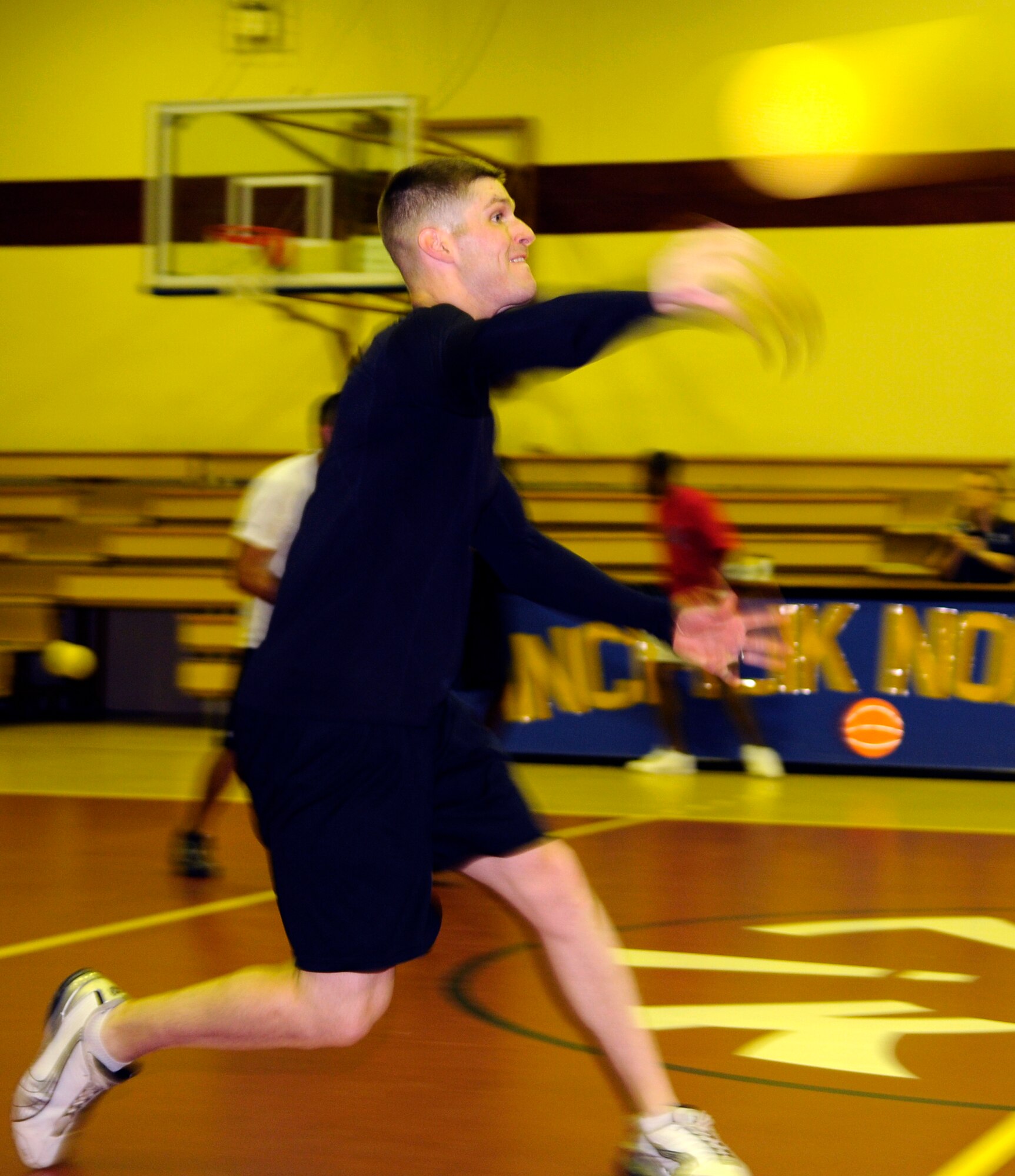 William Hoke, 39th Medical Operations Squadron, fires away at members of the team representing the 90th Expeditionary Air Refueling Squadron during late-night dodgeball May 29, 2009, at the Incirlik Fitness Center.  The two teams were the only to show up for the event in which the 39th MDOS won the first seven matches.  However, the 817th EARS came back to win the next four before the teams called it quits.  (U.S. Air Force photo/Staff Sgt. Raymond Hoy)