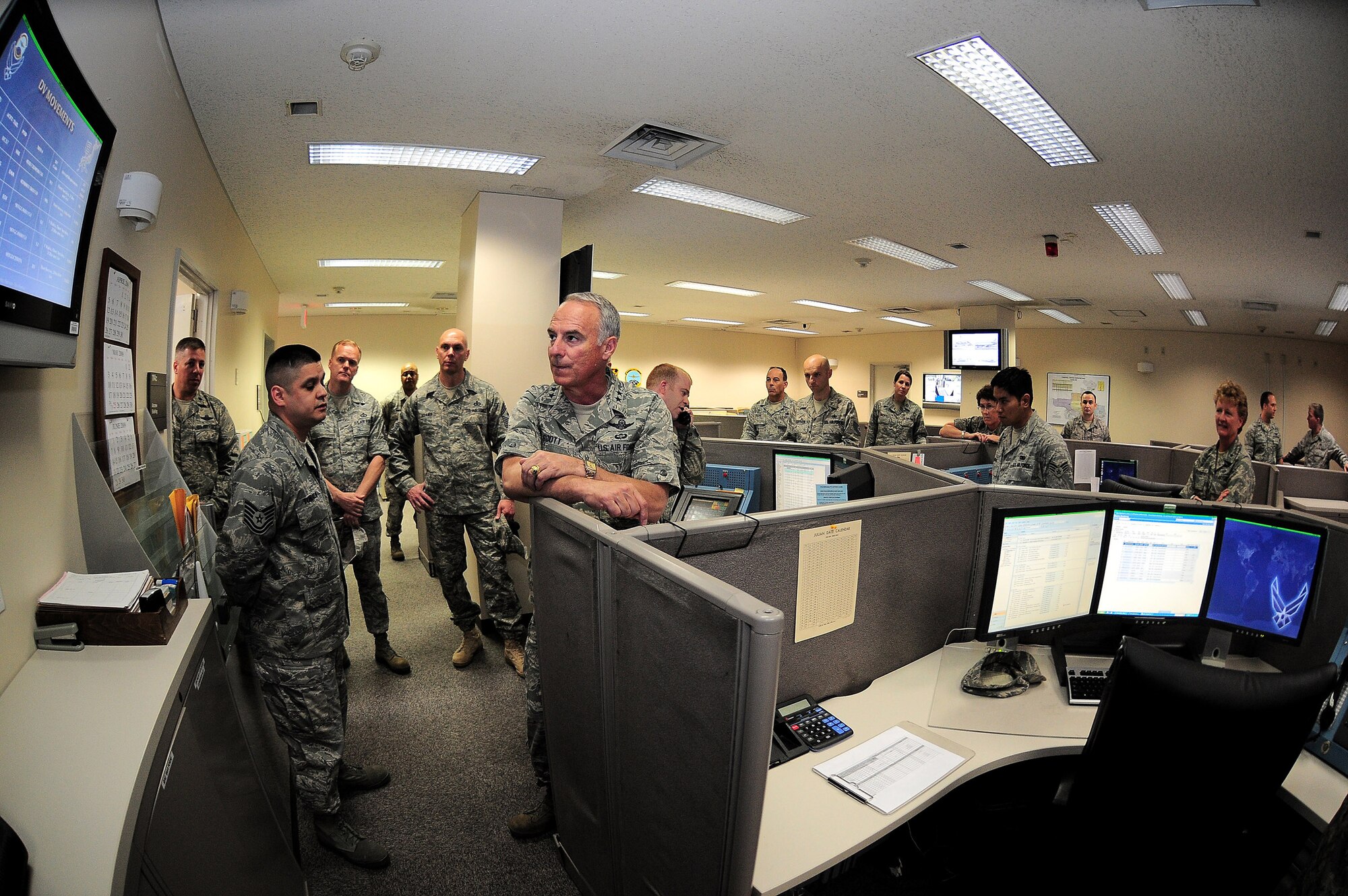 YOKOTA AIR BASE, Japan -- Tech. Sgt. Nelson Tomala, 730th Air Mobility Squadron, briefs Maj. Gen. Winfield W. Scott III,18th Air Force Commander, during a tour of Yokota Air Base May 31. General Scott was here looking for innovative ideas to revamp the mobility system through out the Air Force. (U.S. Air Force photo/Airman 1st Class Michael Dillon)  