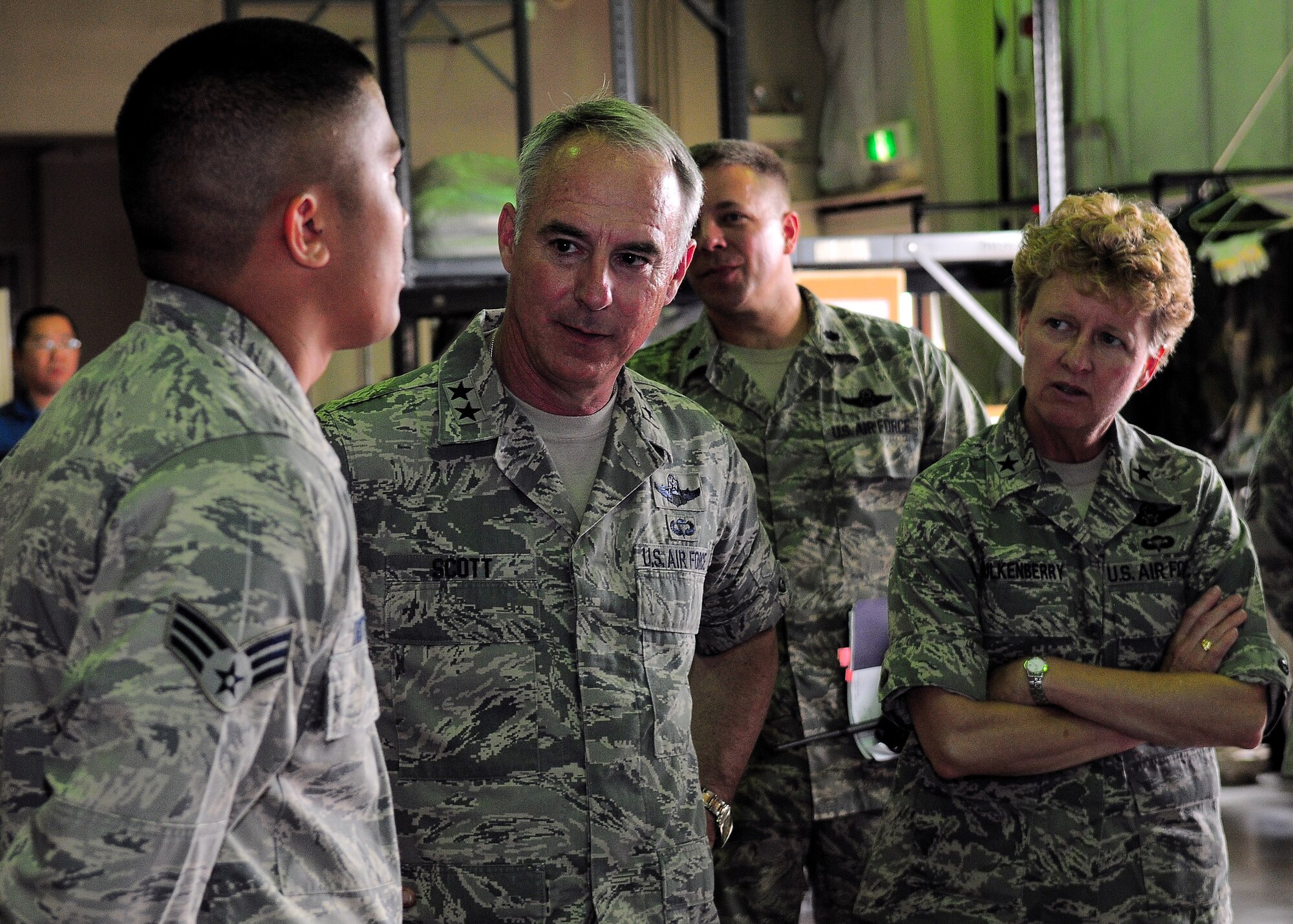 YOKOTA AIR BASE, Japan -- Maj. Gen. Winfield W. Scott III, 18th Air Force commander, and Brig. Gen. Barbara Faulkenberry, 15th Expeditionary Mobility Task Force commander, meet with Senior Airman Ryan Taitano, 730th Air Mobility Squadron, May 31. General Scott was here looking for innovative ideas to revamp the mobility system throughout the Air Force. (U.S. Air Force photo/Airman 1st Class Michael Dillon)
