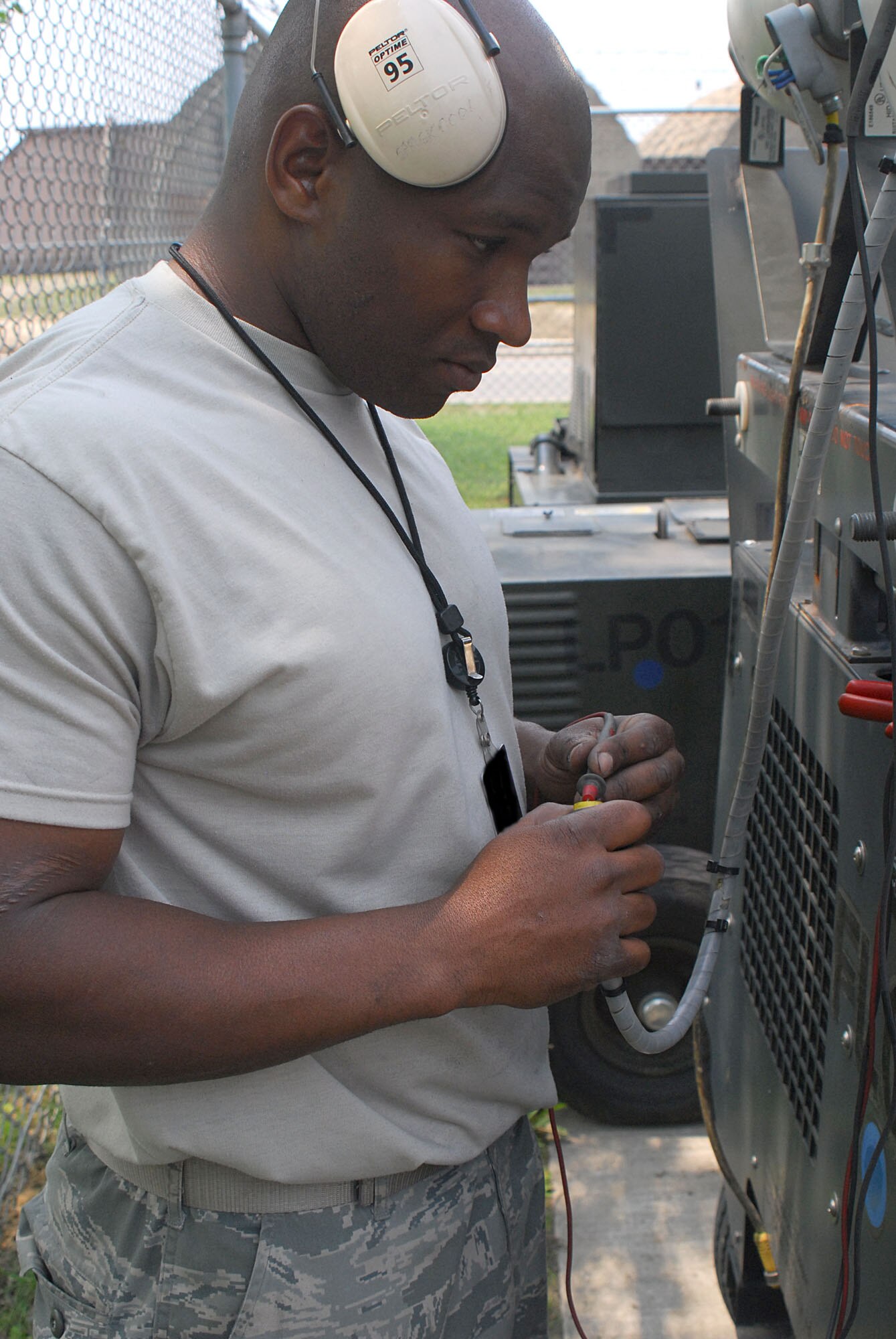 Staff Sgt. Tony Williams performs a voltage checks on an FLD1 which is used for security lighting at the 51st Aereospace Ground Equipment area May 13 at Osan AB, Republic of Korea. Sergeant Williams is a member of the 51st Maintenance Squadron. (U.S. Air Force photo/Staff Sgt. Terri Barriere)