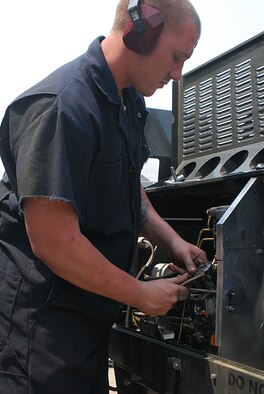 Senior Airman Greg Hawthorn checks the fuel injectors on a new generation heater at the 51st Aereospace Ground Equipment area May 13 at Osan AB, Republic of Korea. Airman Hawthorn is a member of the 51st Maintenance Squadron. (U.S. Air Force photo/Staff Sgt. Terri Barriere)
