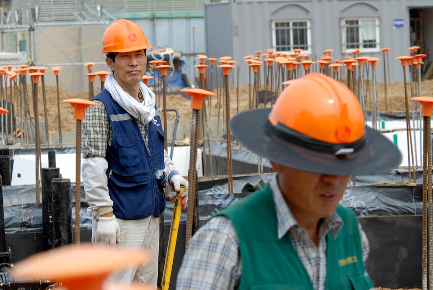 Contractors working at Kunsan Air Base, Republic of Korea, lay plumbing for a new dormitory, June 03, 2009. The new dorm is scheduled to be completed in 2010. (U.S. Air Force Photo by SSgt Jason Colbert)