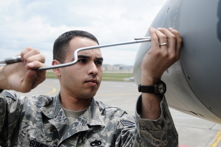 MISAWA AIR BASE, Japan -- Staff Sgt. Adan Gomez, 35th Aircraft Maintenance Squadron, completes a time compliance technical order of an F-16 Fighting Falcon June 1, 2009. The 14th Fighter Squadron, along with maintenance and support personnel, will participate in Northern Edge scheduled for later this month. (U.S. Air Force photo by Senior Airman Jamal D. Sutter)