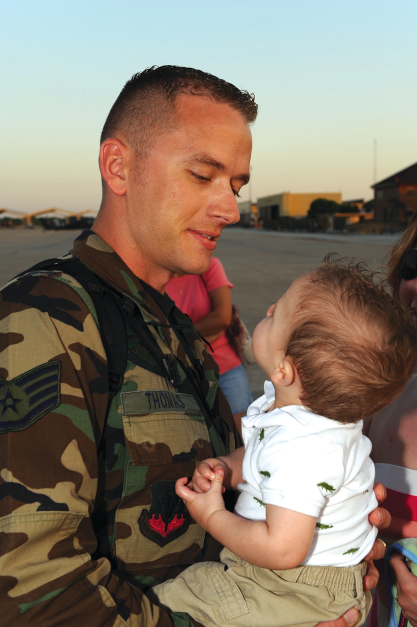 WHITEMAN AIR FORCE BASE, Mo. – Staff Sgt. Jeremy Thomas, 509th Maintenance Operations Squadron, holds his 10-month-old son, Gavin, May 29 after returning to Whiteman from a recent deployment to Andersen Air Force Base, Guam. More than 150 family members, friends and co-workers welcomed the returning deployers home. (U.S. Air Force photo/Airman 1st Class Carlin Leslie)