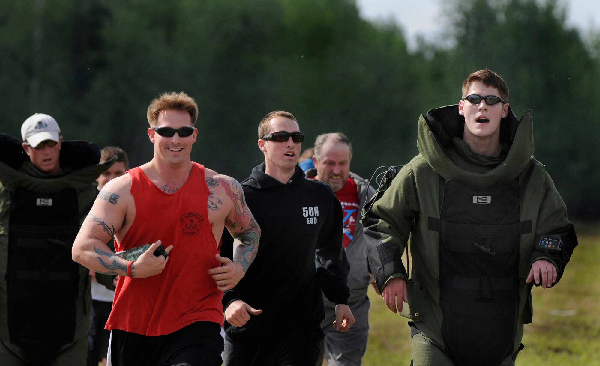 The 354th Civil Engineering Squadron Explosive Ordnance Flight run their first bomb suit run, a tradition for EOD flights throughout the Air Force May 30, 2009, North Pole, Alaska. The 3.2-mile cross country run was to raise money for the Wounded EOD Foundation, a non-profit organization that provides funds and support to military EOD families caring for their loved ones at military medical facilities across the country.  (U.S. Air Force photo/Airman 1st Class Laura Max)