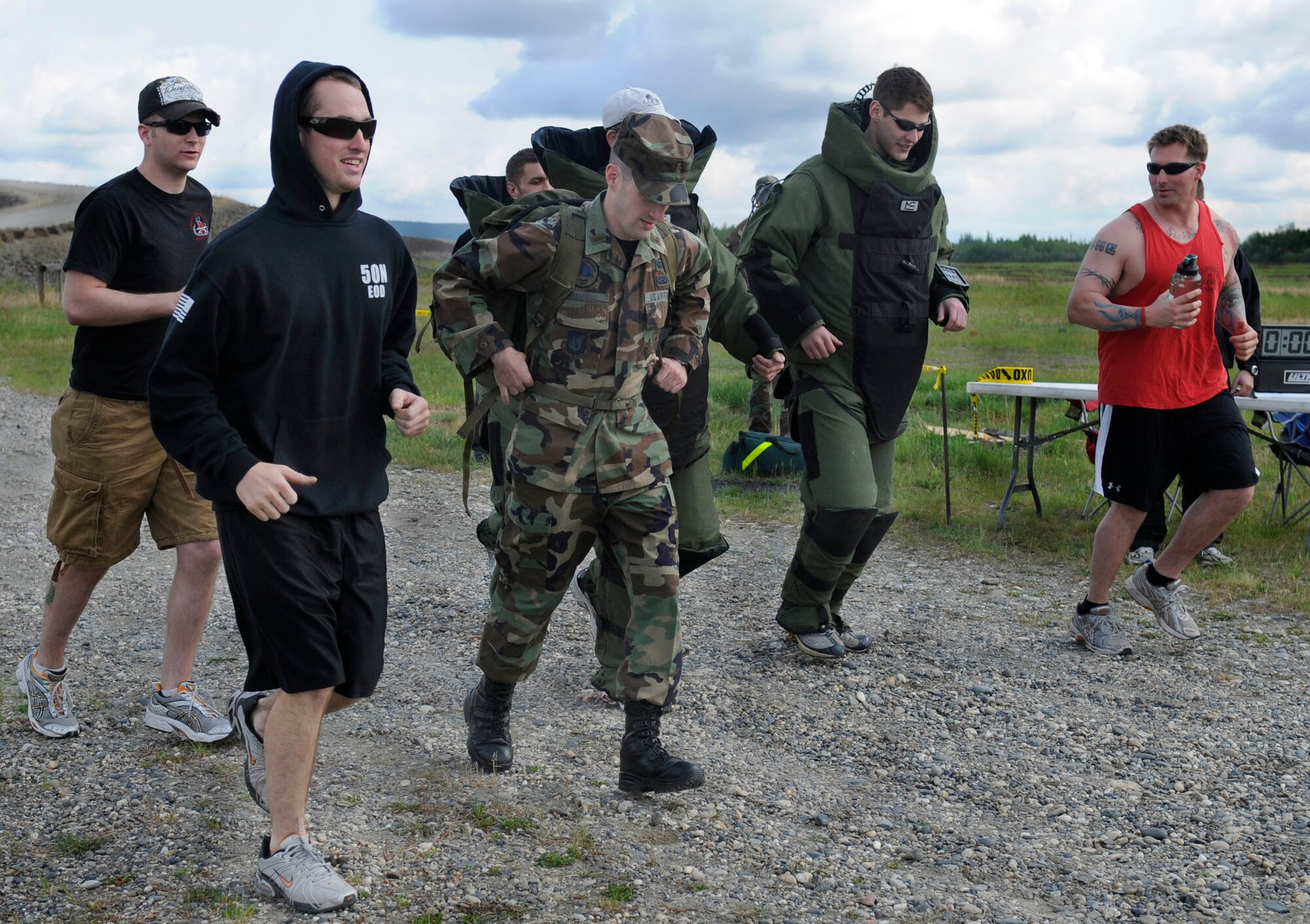 Airmen run a 5K in the bomb suit during the 354th Civil Engineering Explosive Ordnance Disposal flight's first bomb suit run May 30, 2009, North Pole, Alaska. Running in the 75-pound bomb suit recognizes the suffering of wounded teammates while coming together to raise money for the wounded EOD Warrior Foundation. (U.S. Air Force photo/Airman 1st Class Laura Max)