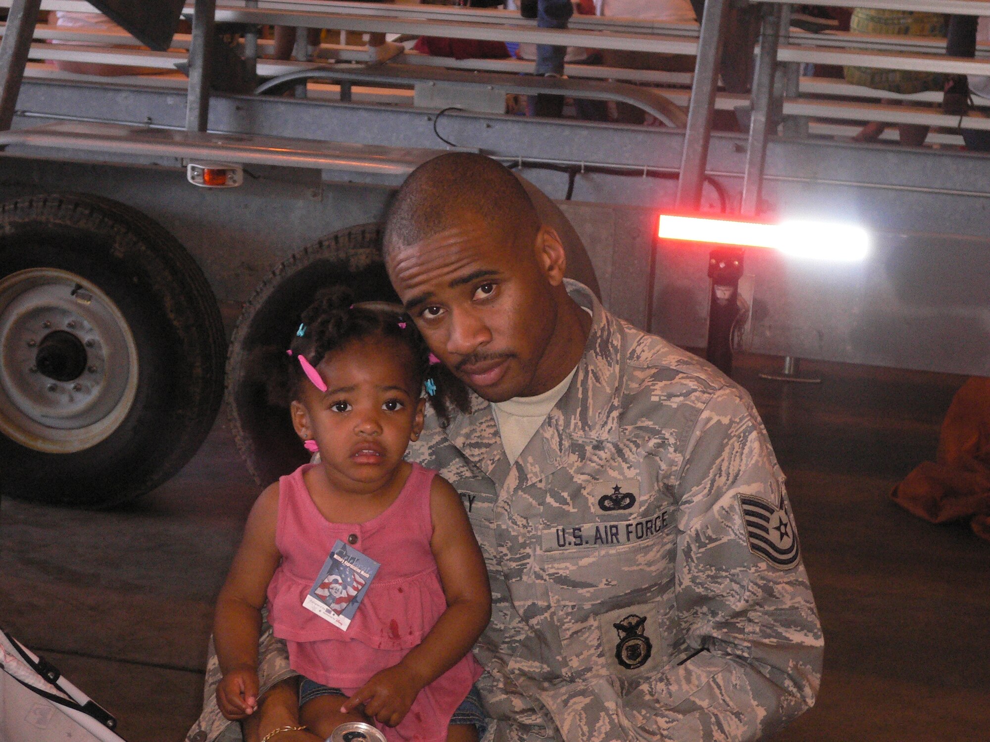 BUCKLEY AIR FORCE BASE, Colo. -- Tech. Sgt. Imari Motley, non-commissioned officer in charge of physical security with Detachment 3 Aerospace Data Facility-Colorado, poses in a photo with his daughter, Imaiya.  Sergeant Motley is Team Buckley's Warrior of the Week for May 29- June 4.  "My most memorable personal accomplishment is my family because without their support I wouldn't be where I am today.  I know that no matter how hard times get I can rely on them." (Courtesy Photo)