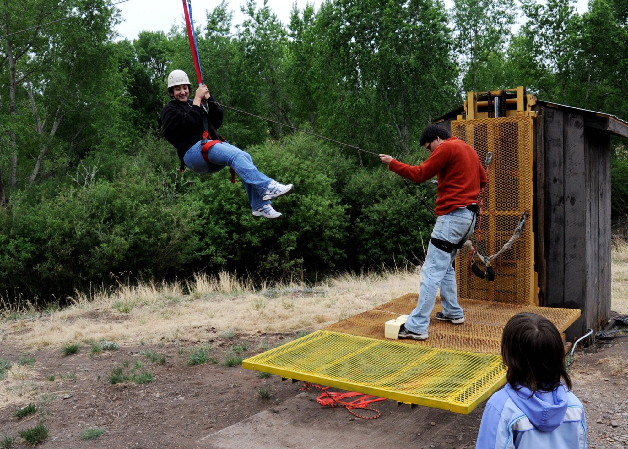 CANNON AIR FORCE BASE, N.M.-- Staff Sgt. Xochiquetzal Baldwin, 27th Special Operations Wing Chapel, rides the zip line in Ruidoso, N.M., May 16 during Cannon?s first Air Commando Family Retreat. The base chapel hosted the retreat for Cannon families, where they learned about reintegration after a deployment and couples communication. The chapel hopes to conduct similar retreats at least once a year. (U.S Air Force photo by Airman 1st Class Evelyn Chavez)