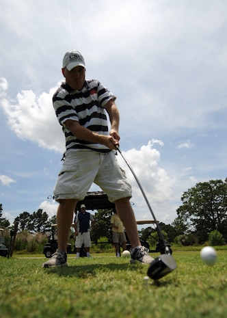 Jeff Price tees off at the 15th hole of the Wrenwoods Golf Course on Charleston AFB June 3. Wrenwoods is a Par 72 course open daily from 7 a.m. to dusk. Price is a member of the U.S. Coast Guard. (U.S. Air Force photo/Senior Airman Timothy Taylor)