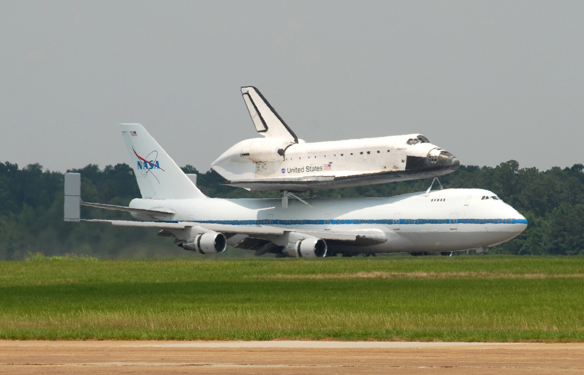 Space Shuttle Atlantis riding atop a NASA-modified Boeing 747 Shuttle Carrier Aircraft taxies after landing June 2 at Columbus Air Force Base, Miss. Columbus AFB was the shuttle's final stop for fuel before finishing its journey to Kennedy Space Center, Fla. (U.S. Air Force photo/Mary Crump)
