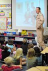 Lt. Col. Joe Alcorn, an HH-60G Pave Hawk pilot, speaks to his son's 2nd grade class at Gemini Elementary in Melbourne Beach, Fla. Colonel Alcorn and other reservists from the 920th Rescue Wing, Patrick Air Force Base, Fla., spent four months in Afghanistan supporting joint operations. Colonel Alcorn showed the class images of an Afghan school he visited. The Afghani children received school supplies donated by the 2nd graders. (U.S. Air Force photo/Master Sgt. Rob Grande)