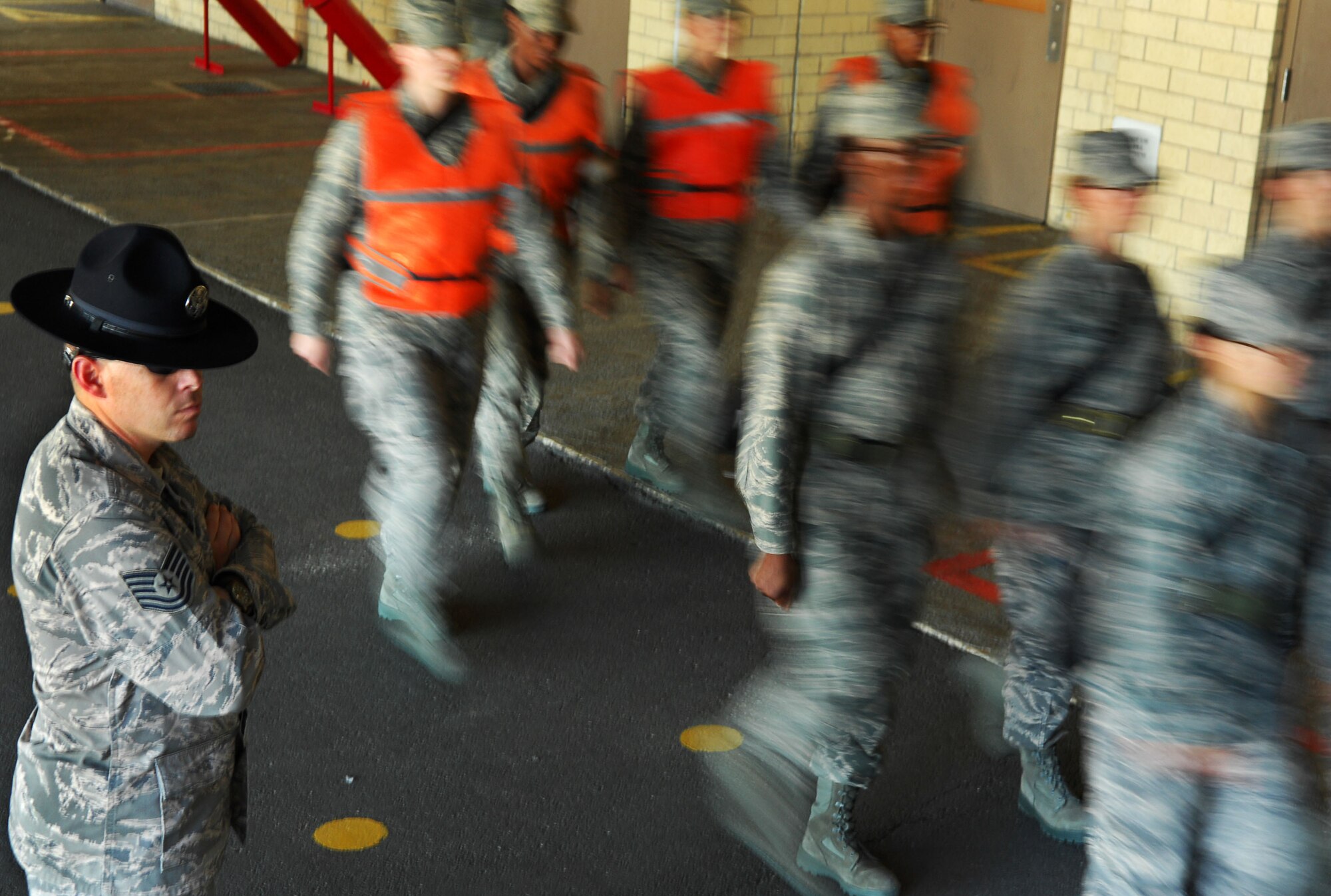 LACKLAND AIR FORCE BASE, Texas -- A military training instructor watches a flight of trainees march to the dining facility October 2008 during basic military training. (U.S. photo by Staff Sgt. Trina R. Jeanjacques)(RELEASED)