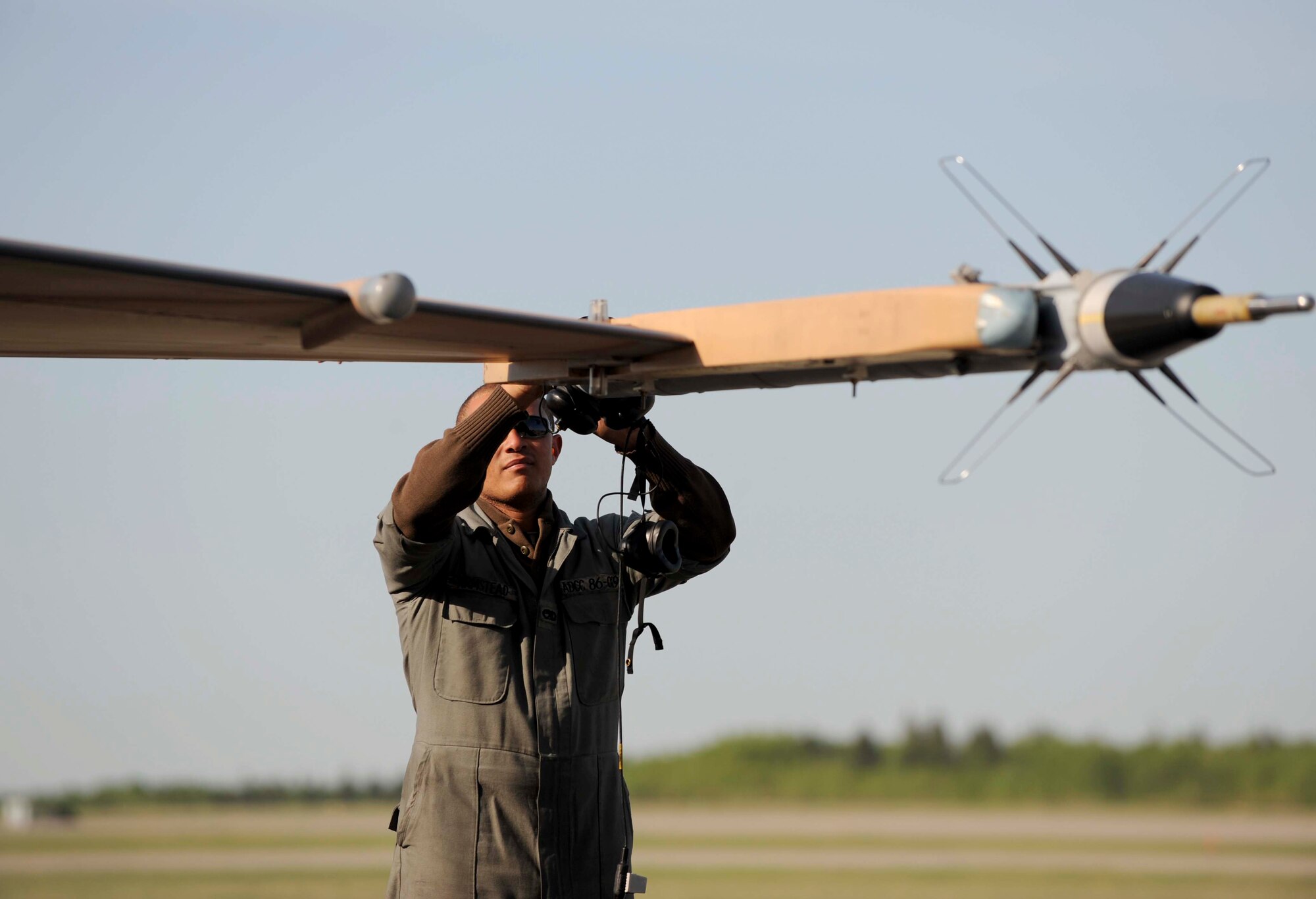 Senior Airman Alex Armstead, an F-16 Fighting Falcon Aggressor crew chief, assigned to the 57th Aircraft Maintenance Squadron, Nellis Air Force Base, Nev., finalizes his pre-flight aircraft inspection  before morning launch during exercise Maple Flag 42 at 4 Wing Cold Lake, Canada, June 2. Maple Flag is a Canadian-sponsored and Air Combat Command supported exercise, that provides aircrews simulated air and ground combat training to coalition forces in a NATO environment.
(U.S. Air Force Photo/Senior Airman Larry E. Reid Jr., Released)