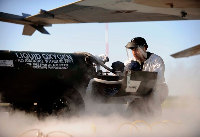 Senior Airman Robert Smith, an F-16 Fighting Falcon Aggressor crew chief, assigned to the 57th Aircraft Maintenance Squadron, Nellis Air Force Base, Nev., conducts liquid oxygen servicing before morning launch during exercise Maple Flag 42 at 4 Wing Cold Lake, Canada, June 2. Maple Flag is a Canadian-sponsored and Air Combat Command supported exercise, that provides aircrews simulated air and ground combat training to coalition forces in a NATO environment.(U.S. Air Force Photo/Senior Airman Larry E. Reid Jr., Released)