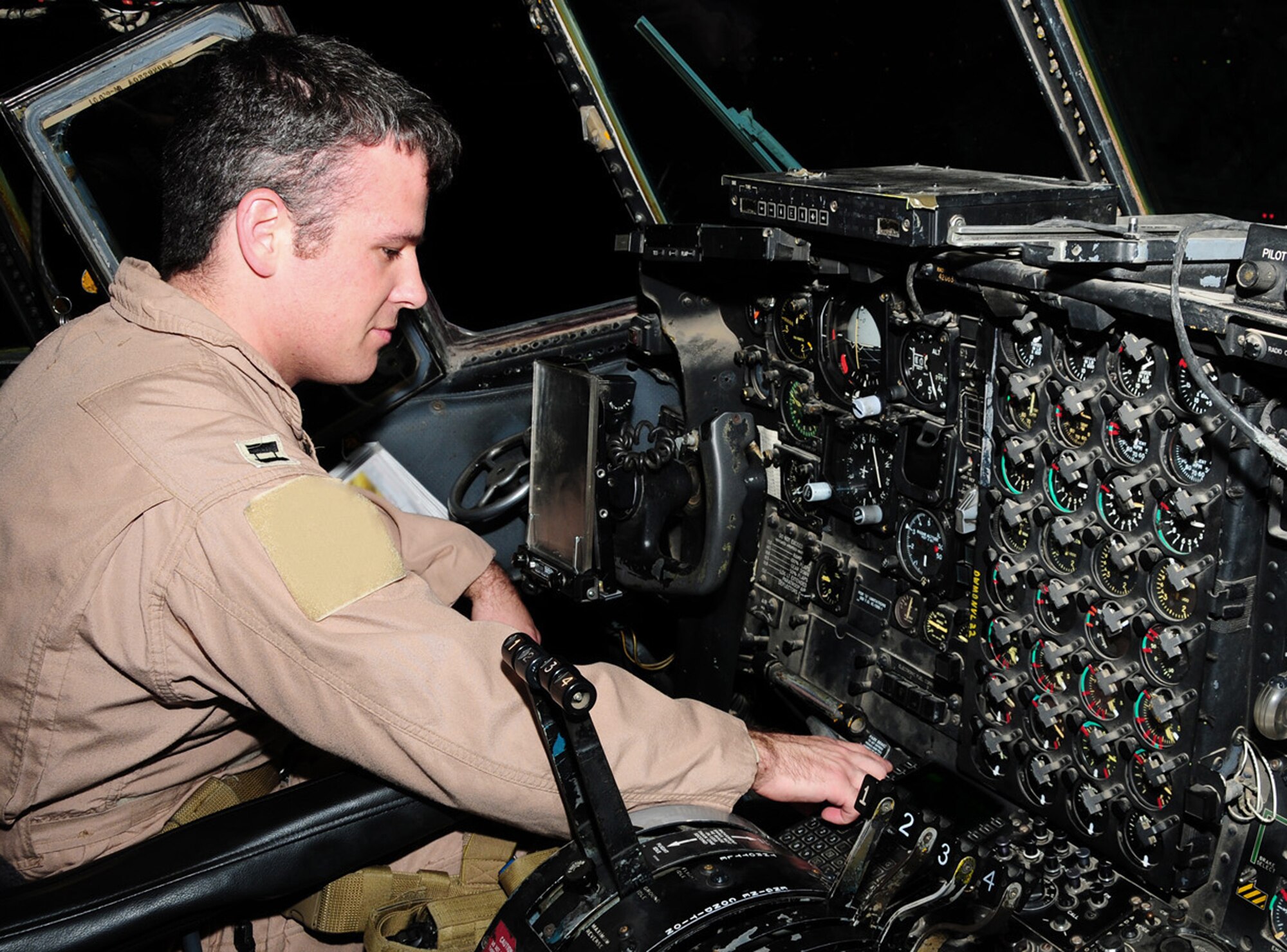 Capt. Andrew Gillis test a navigation radio during his preflight check in a C-130 Hercules May 28 at an air base in Southwest Asia. The navigation radio is used during periods of low flight visibility. Captain Gillis is a 737th Expeditionary Airlift Squadron C-130 aircraft commander deployed from Dyess Air Force Base, Texas. He is originally from San Jose, Calif. (U.S. Air Force photo illustration) 
