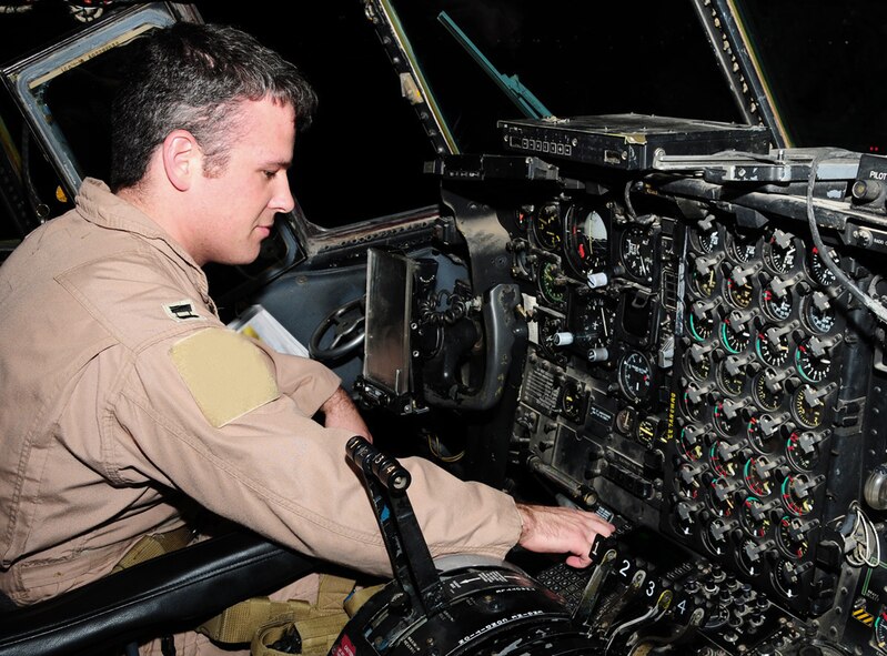Capt. Andrew Gillis test a navigation radio during his preflight check in a C-130 Hercules May 28 at an air base in Southwest Asia. The navigation radio is used during periods of low flight visibility. Captain Gillis is a 737th Expeditionary Airlift Squadron C-130 aircraft commander deployed from Dyess Air Force Base, Texas. He is originally from San Jose, Calif. (U.S. Air Force photo illustration) 