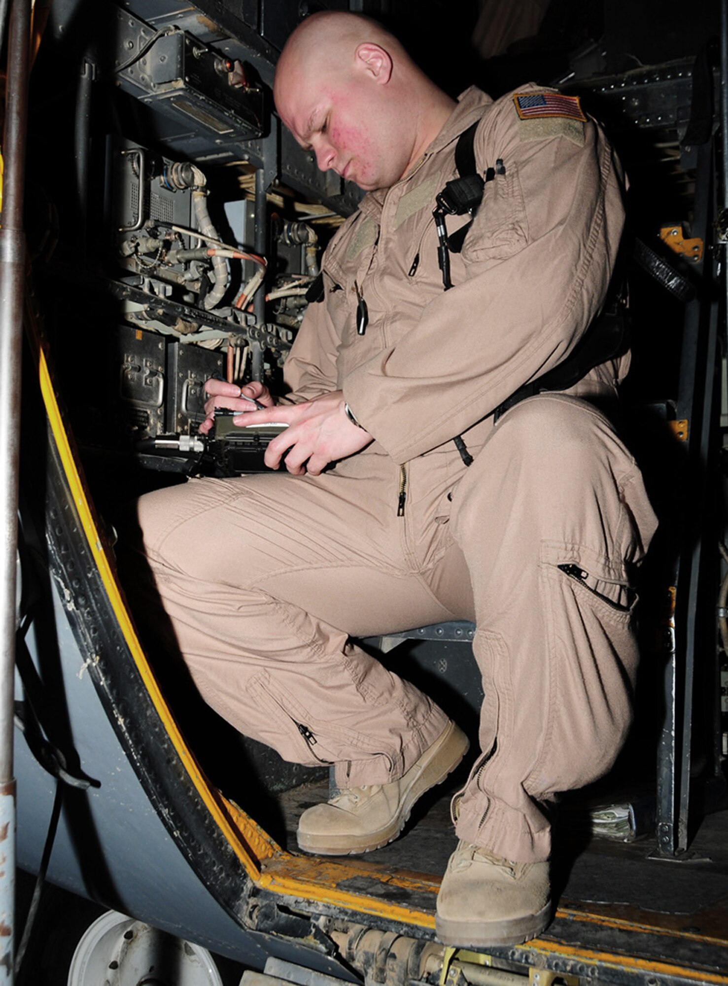 Capt. Andrew Gillis test a navigation radio during his preflight check in a C-130 Hercules May 28 at an air base in Southwest Asia. The navigation radio is used during periods of low flight visibility. Captain Gillis is a 737th Expeditionary Airlift Squadron C-130 aircraft commander deployed from Dyess Air Force Base, Texas. He is originally from San Jose, Calif. (U.S. Air Force photo illustration) 

