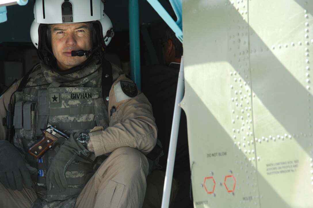 Brig. Gen. Walter D. Givhan, Combined Airpower Transition Force commander, waits at the airport in Kabul, Afghanistan, to launch as a passenger on an Afghan National Army Air Corps MI-35 attack helicopter.   The mission will be the first time in more than eight years that an Afghan aircraft has fired the 12.7mm nose gun and 57mm rockets.   As training and capabilities grow for the ANAAC, this will allow them to provide close-air support to the Afghan National Armed Forces.  (U.S Air Force photo/Tech. Sgt. Parker Gyokeres)