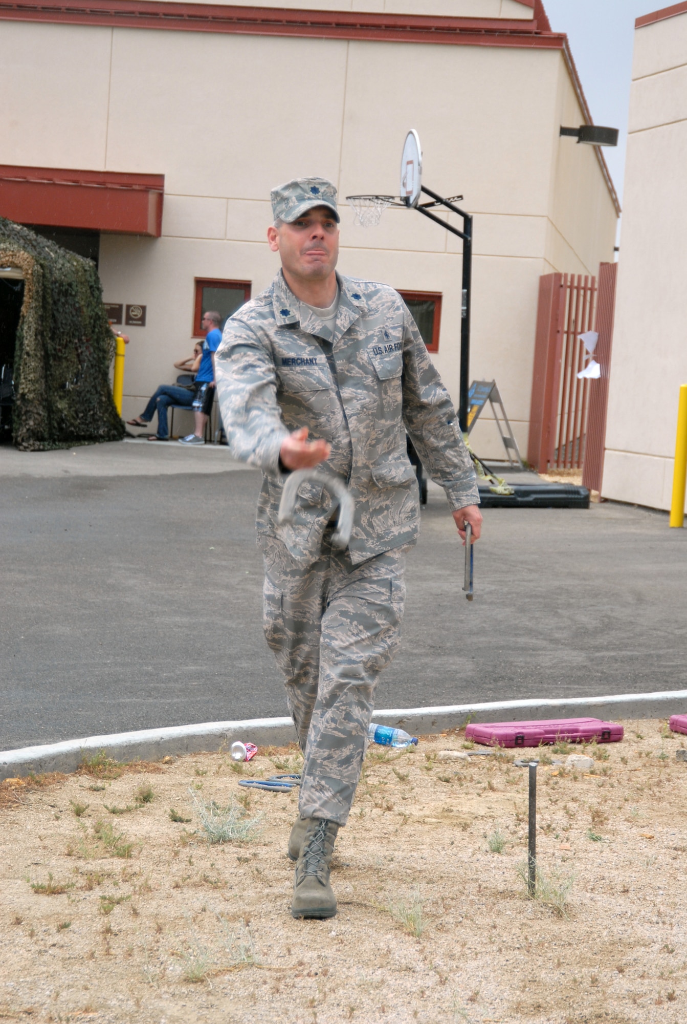 Lt. Col. Ronald Merchant, 95th Medical Support Squadron commander, plays a game of horseshoe during the 95th Medical Group Mash Bash May 29. The name of the third annual event was based on television series M*A*S*H. (U.S. Air Force photo/Senior Airman Julius Delos Reyes)