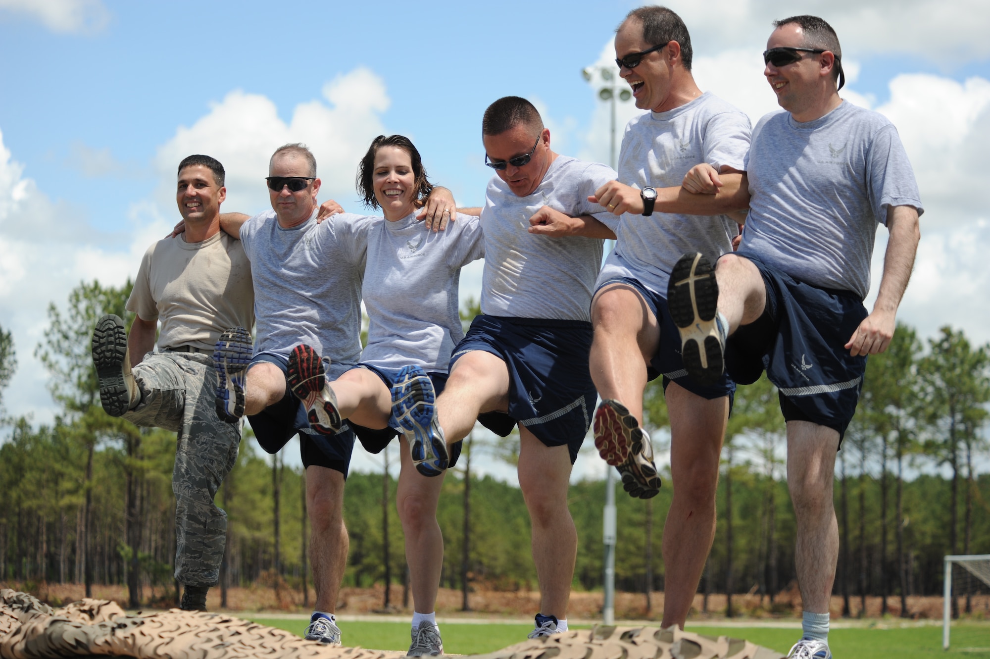 SHAW AIR FORCE BASE, S.C. -- Personnel of the 20th Mission Support Group perform a Rockette-style dance at the end of the Mission Oriented Protective Posture dance contest May 26, during the 20th MSG Operational Readiness Inspection Combat Rally. The combat rally allowed personnel to have fun as they trained in Ability to Survive and Operate events for the June ORI. (U.S. Air Force photo/Senior Airman Matt Davis)