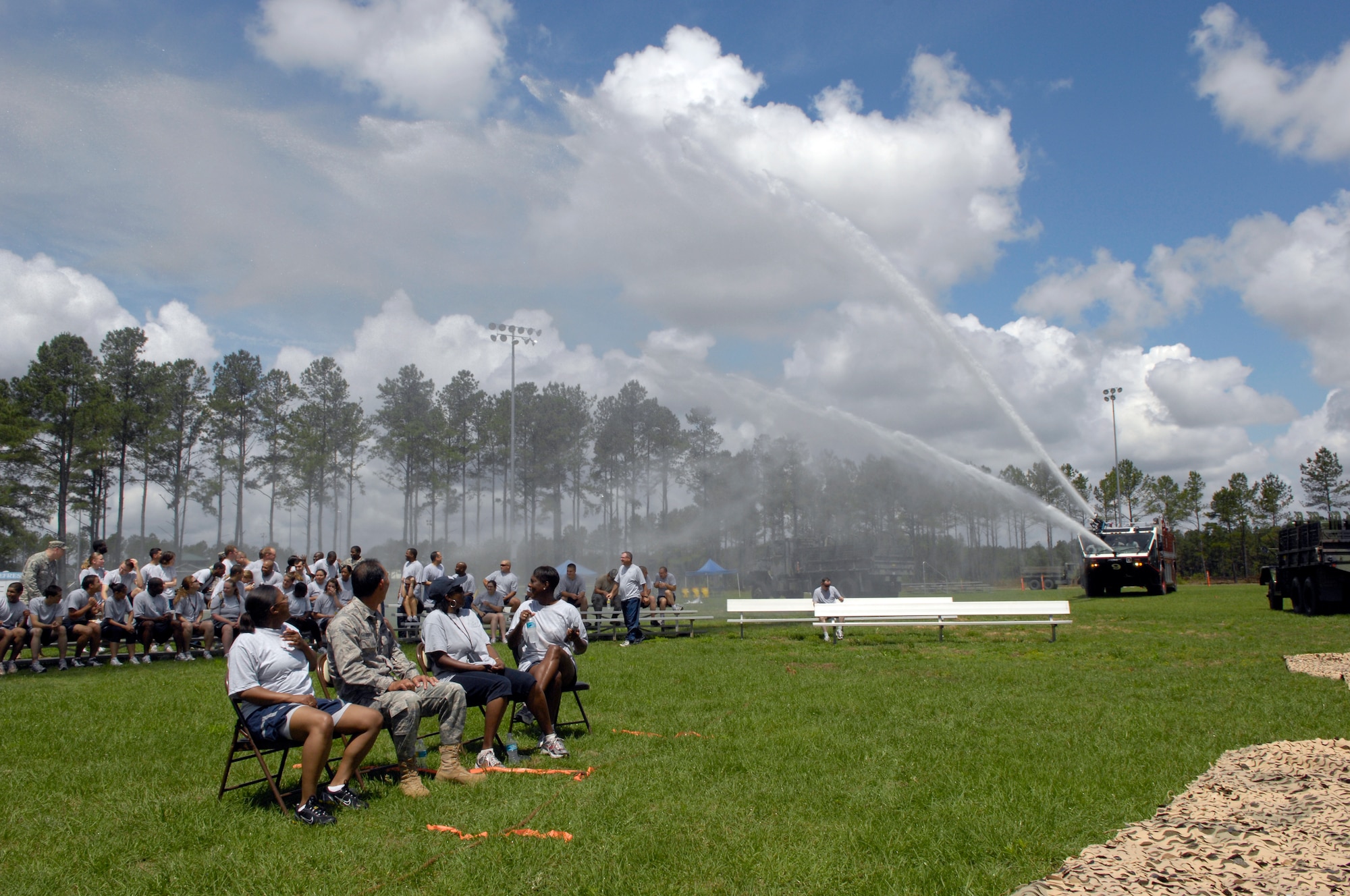 SHAW AIR FORCE BASE, S.C. -- Airmen of the 20th Mission Support Group are sprayed by engine-mounted water cannons during the 20th MSG Operational Readiness Inspection Combat Rally May 26. The rally comprised of combat-themed competitions that served as a refresher in Ability to Survive and Operate procedures for Shaw's ORI in June. (U.S. Air Force photo/Senior Airman Kathrine McDowell)
