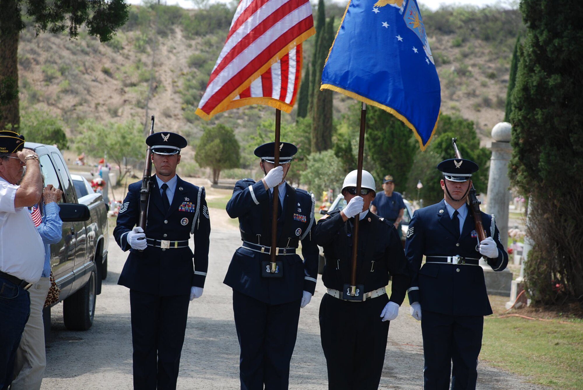 LAUGHLIN AIR FORCE BASE, Texas –The Laughlin Honor Guard with a representative from the San Felipe Del Rio Veteran’s Honor Guard walks through the San Felipe Cemetery to present the colors in South Del Rio during the Memorial Day ceremony held there May 30.  Colonel Cernicky was the speaker and San Felipe Del Rio Veteran’s Honor Guard members worked with the San Felipe Honor Guard to present the colors. More than 100 people attended the solemn ceremony. (U.S. Air Force photo by Tech. Sgt. Joel Langton)