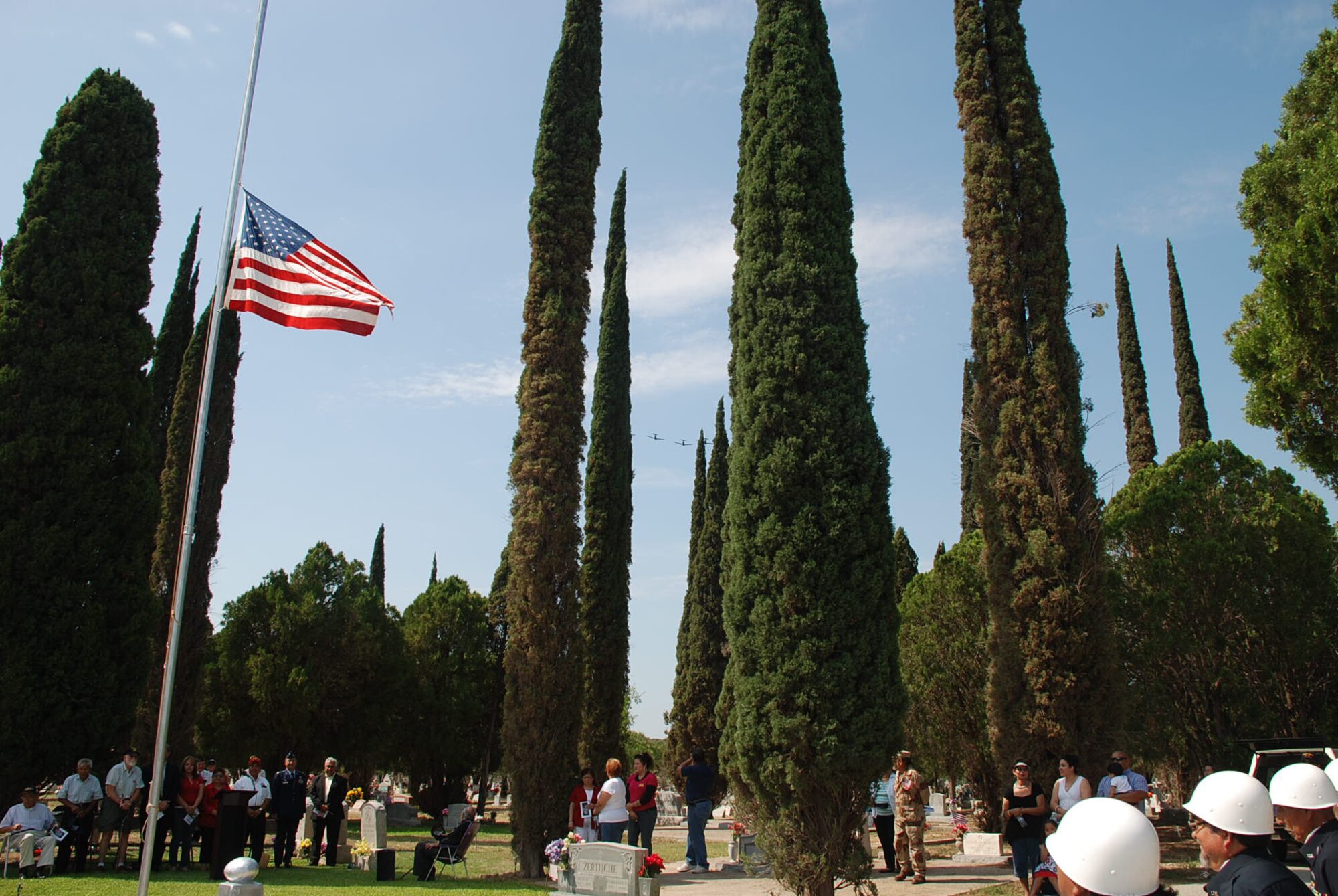 LAUGHLIN AIR FORCE BASE, Texas – Four Laughlin T-6s fly over the Memorial Day ceremony held May 30 at San Felipe Cemetery in South Del Rio.  Col. Andrew Cernicky was the speaker and Laughlin Honor Guard members worked with the San Felipe Del Rio Veteran’s Honor Guard to present the colors. More than 100 people attended the solemn ceremony. (U.S. Air Force photo by Tech. Sgt. Joel Langton)
