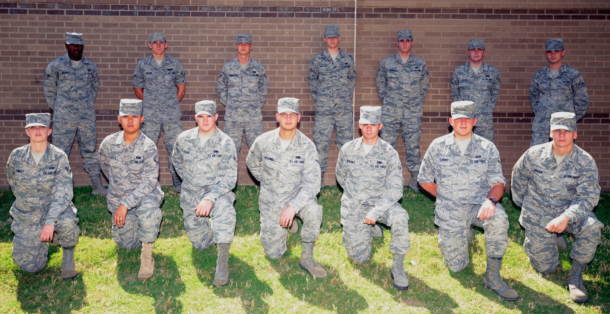 MCCONNELL AIR FORCE BASE, Kan. -- Congratulations to Team McConnell’s newest First Term Airman’s Center graduates who graduated June 5. Back row: Airmen 1st Class Zachary Woods, Marcus Hudson, Bob Carmichael, Jacob Van Dyke, Clayton Thuernagle, TJ Brown and Michael Heasley.  Front row: Airmen 1st Class Kara Reinert, Aris Livica, Airmen Jesse Oliver, Eric McDaniel, Thomas Maroney, Derrick Clarke and Joseph Houser.  (Photo by Staff Sgt. Ronald Lafosse)