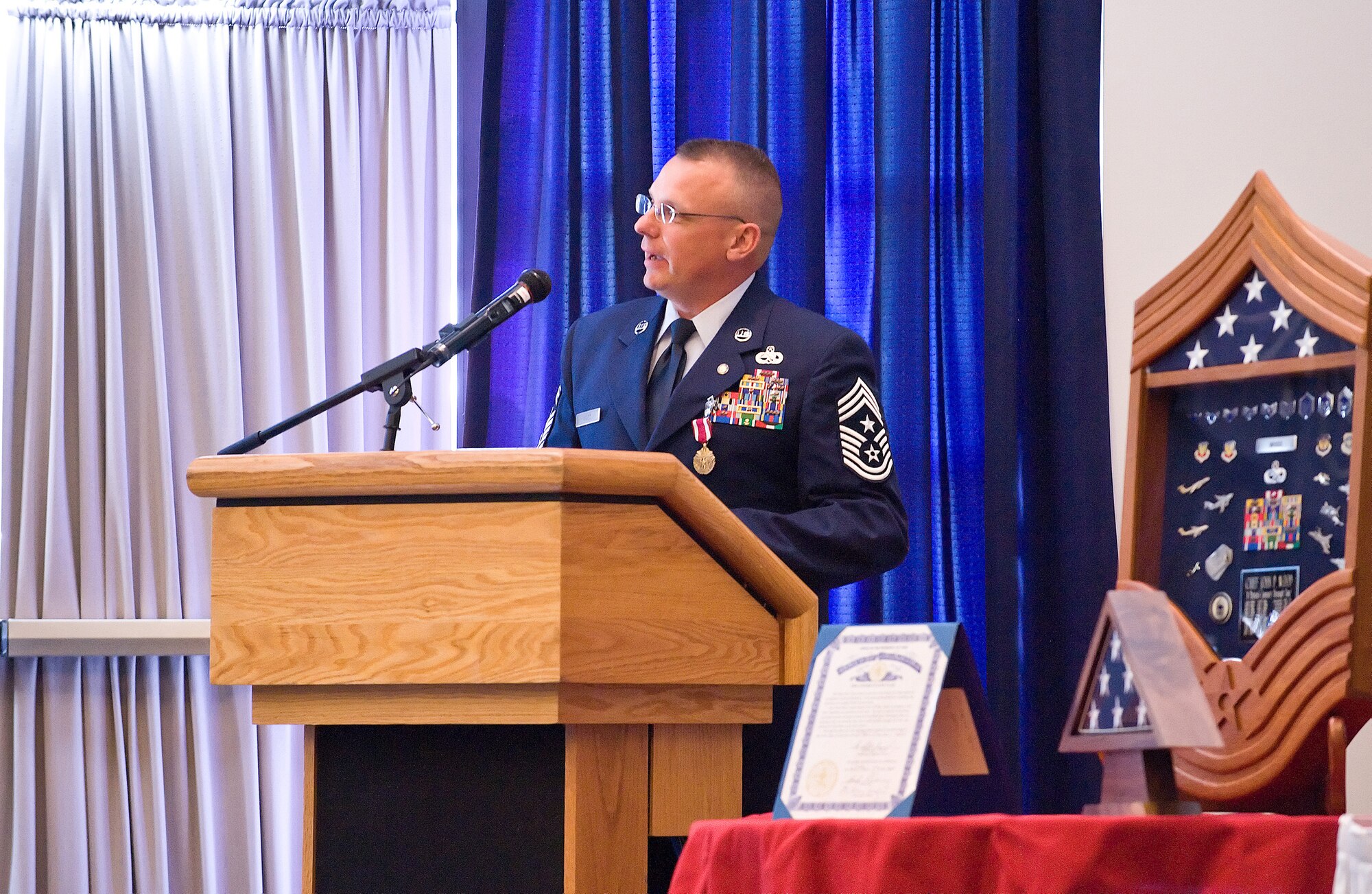 Chief Master Sgt. John Wood, 436th Airlift Wing command chief, speaks during his retirement ceremony May 28 at The Landings Club. Chief Wood retired after 22 years of service. Chief Master Sgt. Daniel Chadwick is currently serving as the interim command chief for the Eagle Wing. (U.S. Air Force photo/Tom Randle)