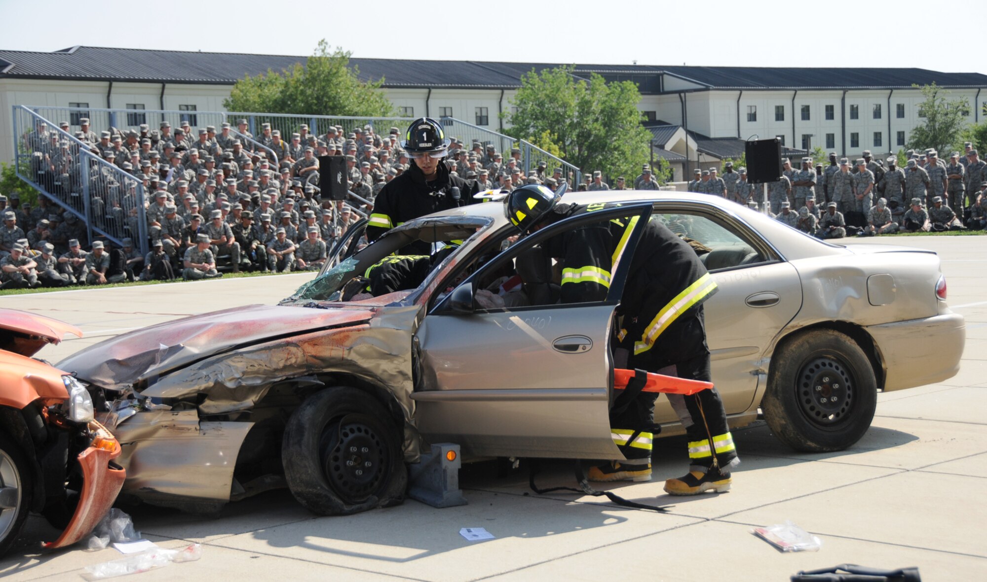 Firefighters extricate the “victims” of a head-on crash during a skit that underscored the dangers of drinking and driving performed for the 81st Training Group’s nonprior service students, May 27. Staff Sgt. Chris Freimann, a military training leader in the 332nd Training Squadron, coordinated the program which involved people from several training squadrons, the fire department, 81st Security Forces Squadron, an emergency medical technician, 81st Communications Squadron and local law enforcement support.  The skit was part of Keesler’s “101 Critical Days of Summer” observance.  (U.S. Air Force photo by Kemberly Groue)