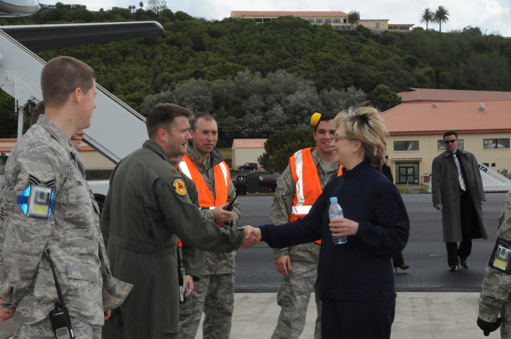 Secretary of State Hillary Rodham Clinton shakes hands with Maj. Jeff Banks, 65th Operations Support Squadron Director of Operations, at Lajes Field, Azores, Portugal on June 3.  Secretary Clinton stopped here en route to Cairo, Egypt to join President Barack Obama for his speech, and participate in the President's meeting with President Hosni Mubarak.  (U.S. Air Force photo by Tech Sgt. Rebecca F. Corey)