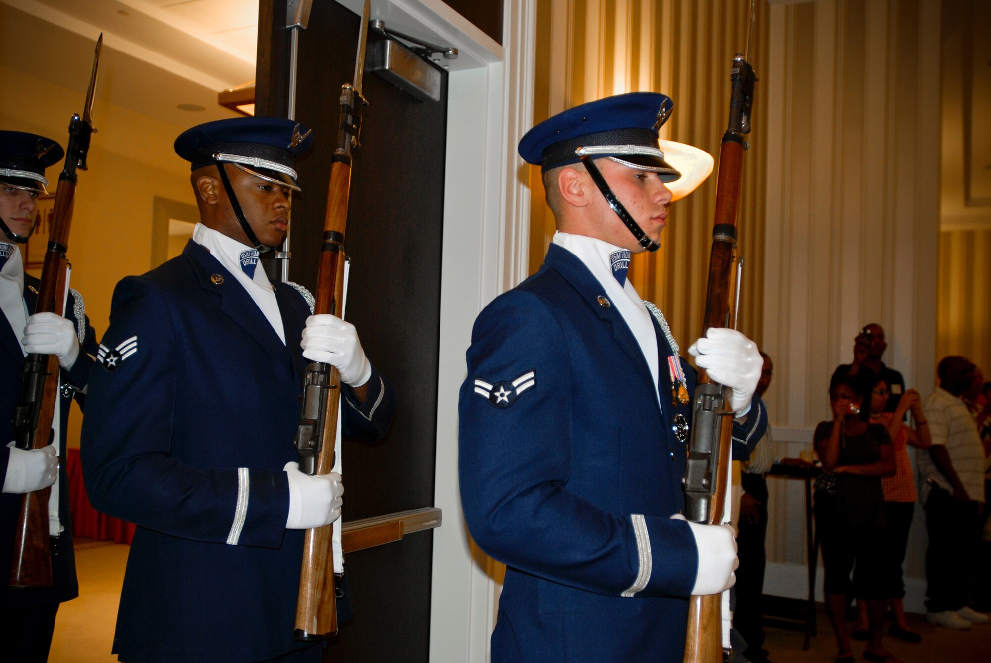 Members of the Air Force Drill Team form up for their performance at the 459th Air Refueling Wing Yellow Ribbon welcome home event. Members of the 459th ARW who recently returned from deployment attended the event to learn more information about services available to them post-deployment and assistance reintegration back into the civilian world.  (U.S. Air Force Photo/ Senior Airman Sasha S. Skirne)