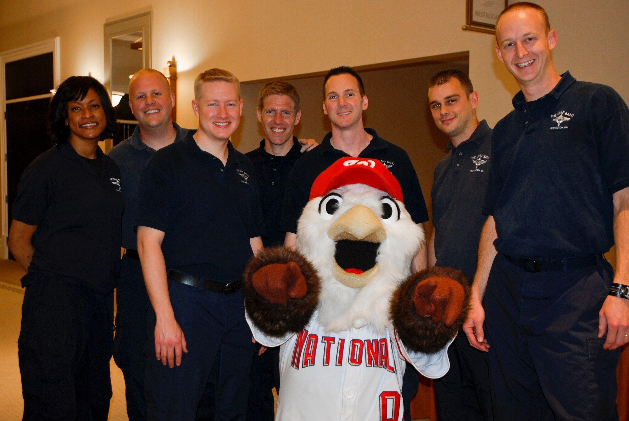 ?Screech? the Washington National's mascot shares the camera with members of the Air Force rock band Max Impact at the 459th Air Refueling Wing Yellow Ribbon welcome home event. Members of the 459th ARW who recently returned from deployment attended the event to learn more information about services available to them post-deployment and assistance reintegration back into the civilian world.  
 (U.S. Air Force Photo/ Senior Airman Sasha S. Skirne)
