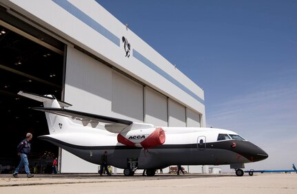 The Advanced Composite Cargo Aircraft rolls out of a hangar in May at Lockheed Martin's Skunk Works plant in Palmdale, Calif. The ACCA is a modified Dornier 328J aircraft. The fuselage aft of the crew station and the vertical tail were removed and replaced with completely new structural designs made of advanced composite materials fabricated using out-of-autoclave curing. Air Force Research Laboratory officials at Wright-Patterson Air Force Base, Ohio, oversee the ACCA program. (Courtesy photo) 
