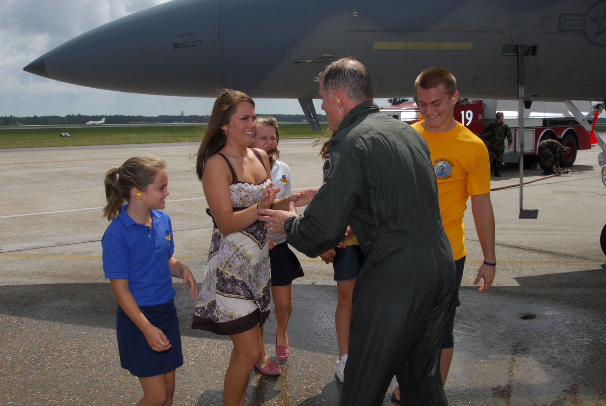 Col. David Kriner is met by his son, Emmett and daughters Kady, Karina, Kasha, and Kendall, after his final flight in the F-15 Eagle.  U.S. Air Force photo by Lisa Norman.