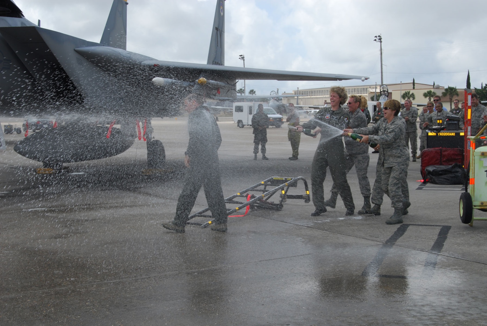 Col. David Kriner is greeted with the traditional champagne spray-down by members of the 601st Air and Space Operations Center staff after his final flight in the F-15 Eagle.  U.S. Air Force photo by Lisa Norman.