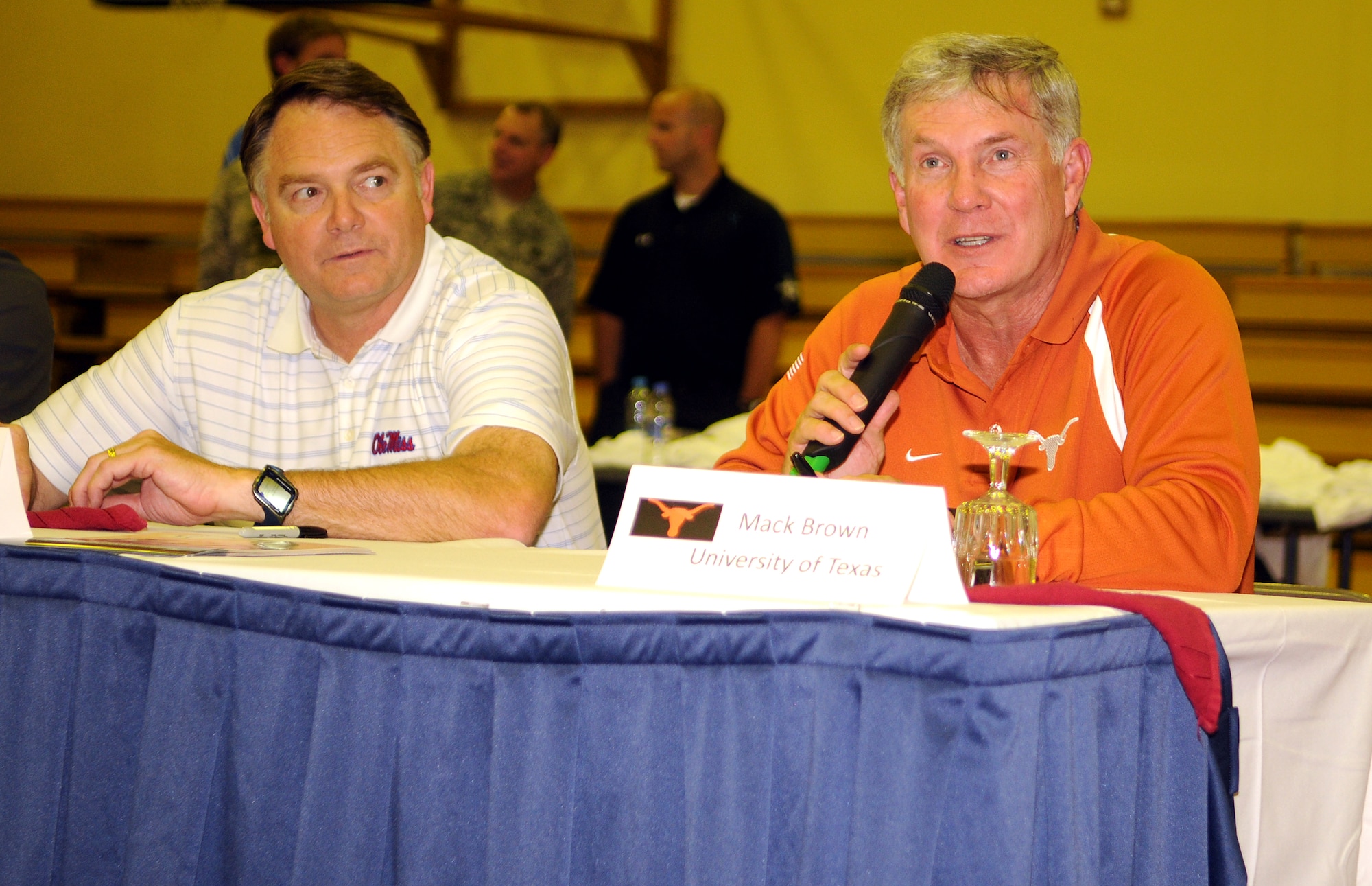University of Texas head football coach Mack brown answers fans’ questions alongside University of Mississippi head football coach Houston Nutt during a Q&A session at the fitness center here on their visit to base Saturday, May 30, 2009. Their visit was part of the Armed Forces Entertainment Coaches Tour. Coach Brown was NCAA’s 2008 coach of the year. (U.S. Air Force photo/Airman 1st Class Alex Martinez)