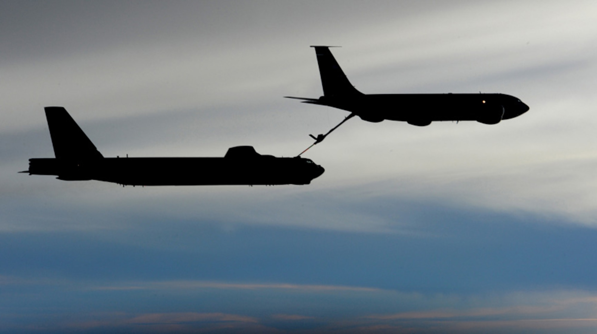 The silhouette of a KC-135R Stratotanker and B-52 bomber are visible during a late-evening aerial refueling mission.  The KC-135R is from the 434th Air Refueling Wing at Grissom.  Highly trained aircrews are able to complete their mission day or night.  (U.S. Air Force photo/Master Sgt. Kevin Gruenwald)




















  












 











































  












 


























