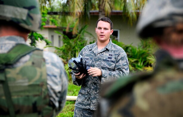 ANDERSEN AIR FORCE BASE, Guam - Airman 1st Class Nathan Woods, 36th Civil Engineer Squadron readiness and emergency management flight logistics and resources, conducts a chemical, biological, radiological, nuclear, and (high-yield) explosives training during a 36th CES field training exercise at Andersen South training facility June 3. Airman Woods is a member of a 10-man shop that conducts approximately eight CBRNE Defense Survival Skills classes per month. (U.S. Air Force photo by Airman 1st Class Courtney Witt)