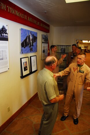 Col. Clyde M. Woltman, former chapter commanding officer and outgoing Marine Aircraft Group 13 commanding officer, speaks to retired Col. Billy McMillin, a former AV-8B pilot and executive officer of Yuma’s Marine Corps Aviation Association’s Tom Miller Squadron at the Sonoran Pueblo at the Marine Corps Air Station in Yuma, Ariz., June 3, 2009. Prior to the change of command, Woltman unveiled a display dedicated to the late Lt. Gen. Thomas H. Miller Jr., the first American to pilot the AV-8A Harrier, for whom the squadron is named.