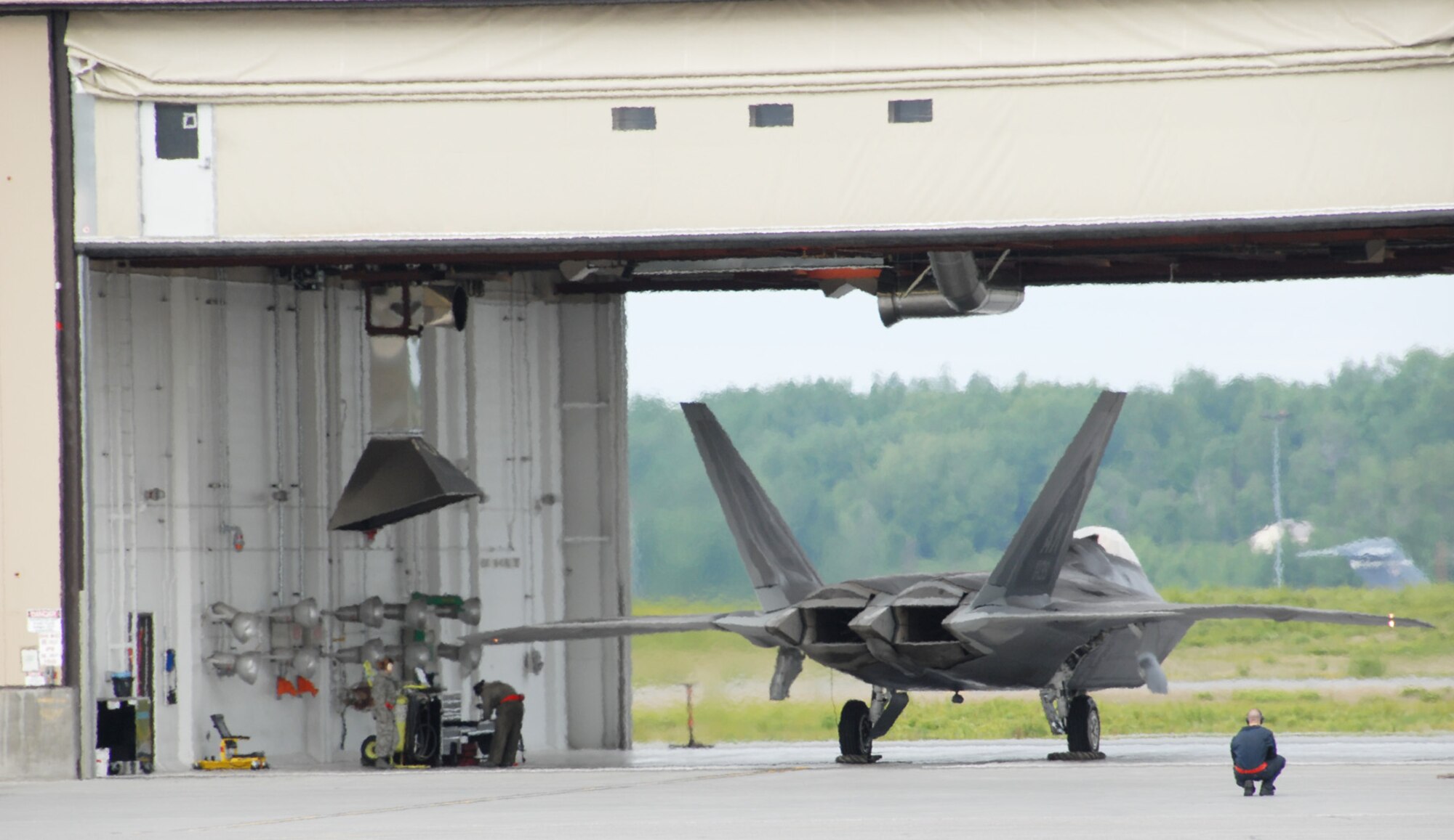ELMENDORF AIR FORCE BASE, Alaska – Reserve Tech. Sgt. Dereck Welch, 477th Aircraft Maintenance Squadron crew chief (far right), prepares an F-22A Raptor for launch during the Headquarters Pacific Air Forces Operational Readiness Inspection June 4. Air Force Reserve Command’s 477th Fighter Group is supporting the 3rd Wing’s efforts during the ORI by providing several Reserve members to assist during the inspection. (U.S. Air Force photo/Staff Sgt. Andrea Knudson)