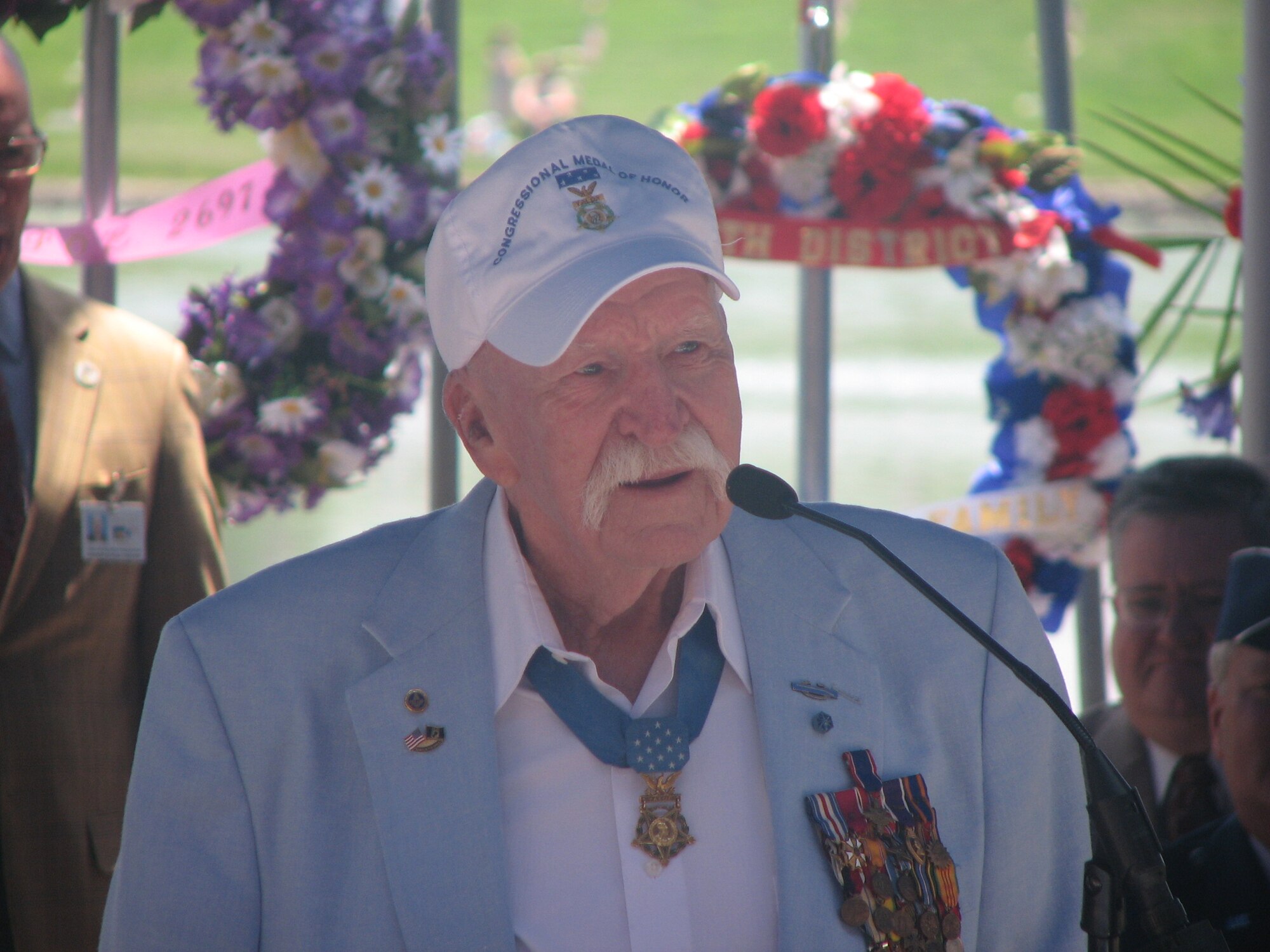 Retired Army Col. Lewis Millett, Medal of Honor Recipient, offers his thoughts on the tribute. Colonel Millett, who was a captain at the time, received the Medal of Honor in 1951 for leading an uphill bayonet charge against enemy forces during the Korean War. (U.S. Air Force photos by Mrs. Walden)