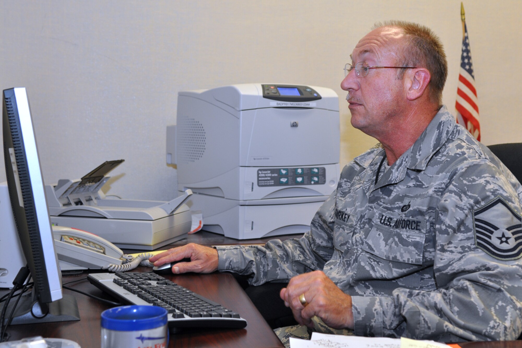 Master Sgt. Harold Starkey, 917th Wing, deployment cycle support manager, works on coordinating plans for the 917th Wing’s first official Yellow Ribbon Reintegration Program event from Barksdale AFB, La., June 3, 2009. The Department of Defense has directed each of the uniform services to develop a YRRP. The scheduled events will bring representatives from different types of organizations such as TRICARE, Military OneSource, financial planners and family counselors, to give information to the servicemembers and their families. Events will be scheduled before the servicemembers leave on deployment and after they return home. The YRRP also creates an avenue to focus on the family and help them in anyway. As the director of the 917th Wing’s YRRP, Sergeant Starkey will be directly involved with each deployed member from notification to completion and beyond. Any 917th Wing member who has deployed for over 90 days to a remote location and has not been contacted by Sergeant Starkey should contact him at DSN 781-9424/9022. (U.S. Air Force photo/Tech. Sgt. Jeff Walston)